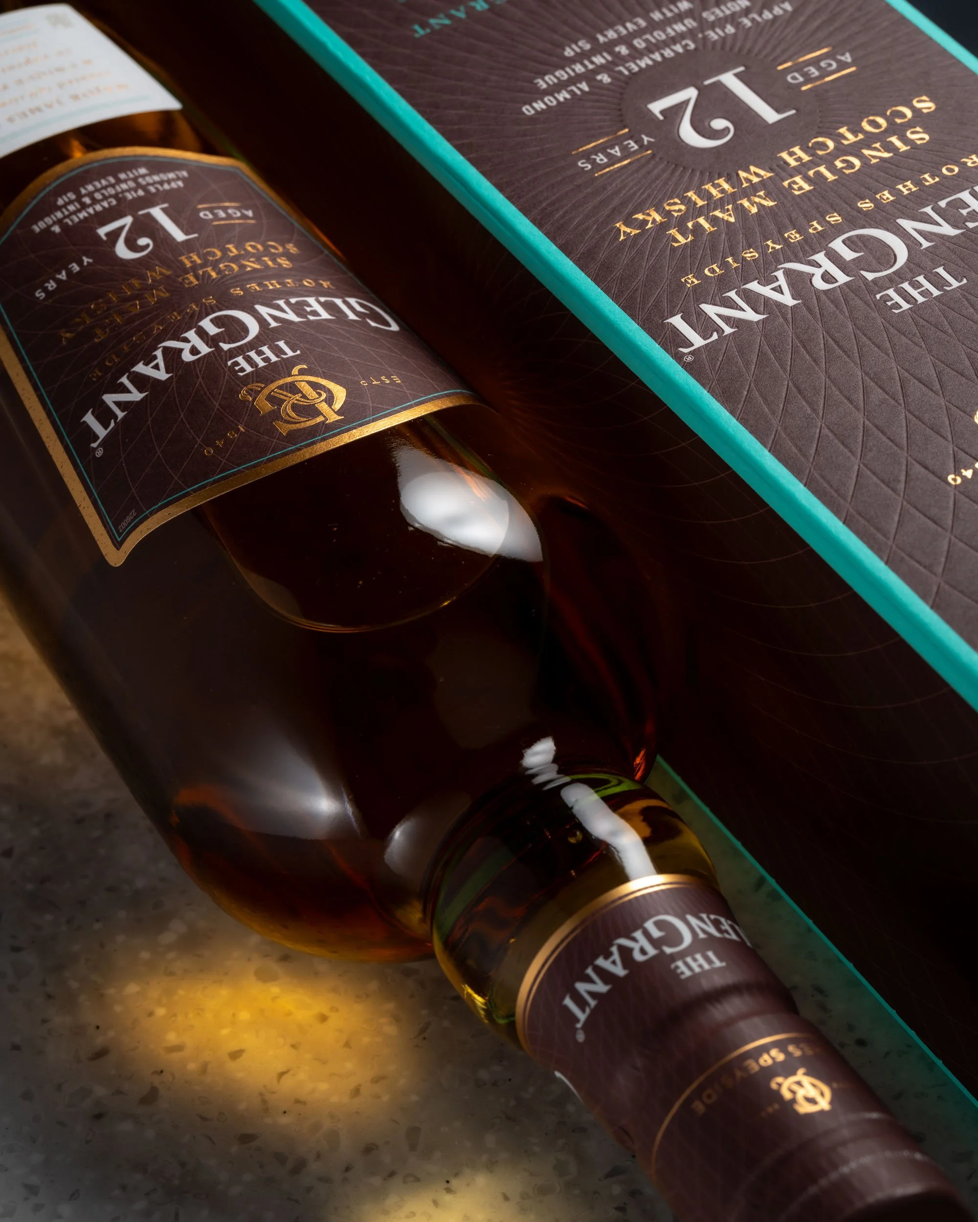 Golden glow from a bottle of Glen Grant 12