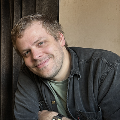 Headshot of Adam Szym