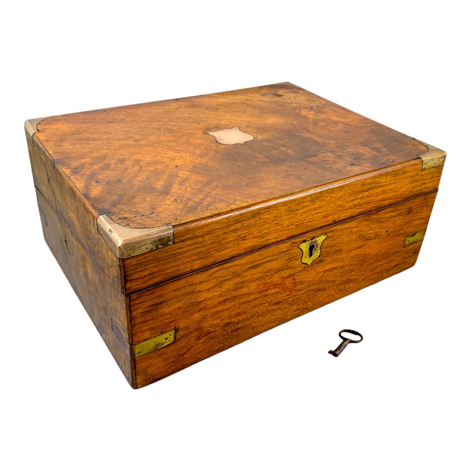 Victorian walnut military campaign writing slope with brass mounts and vacant shield, with key