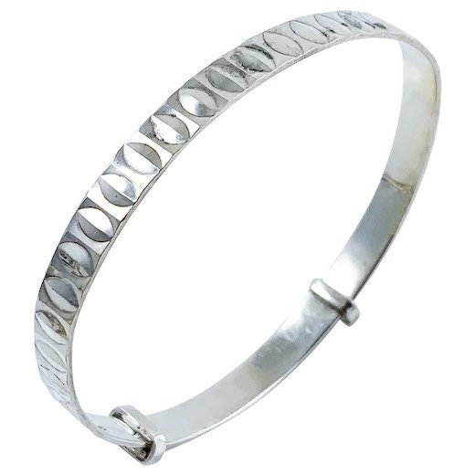 1970’s sterling silver child's adjustable “belt” bracelet with buckle detail and faceted decoration