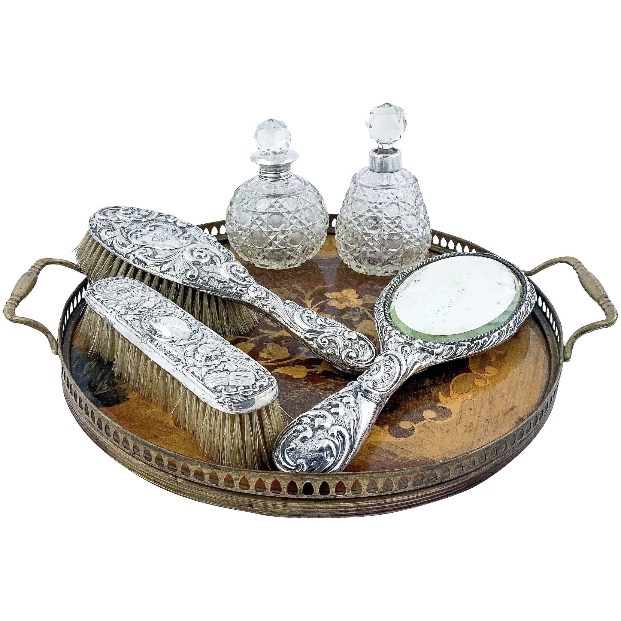 Antique Victorian / Edwardian six piece sterling silver dressing table vanity set (mirror, perfume bottles, brushes) on walnut wooden tray