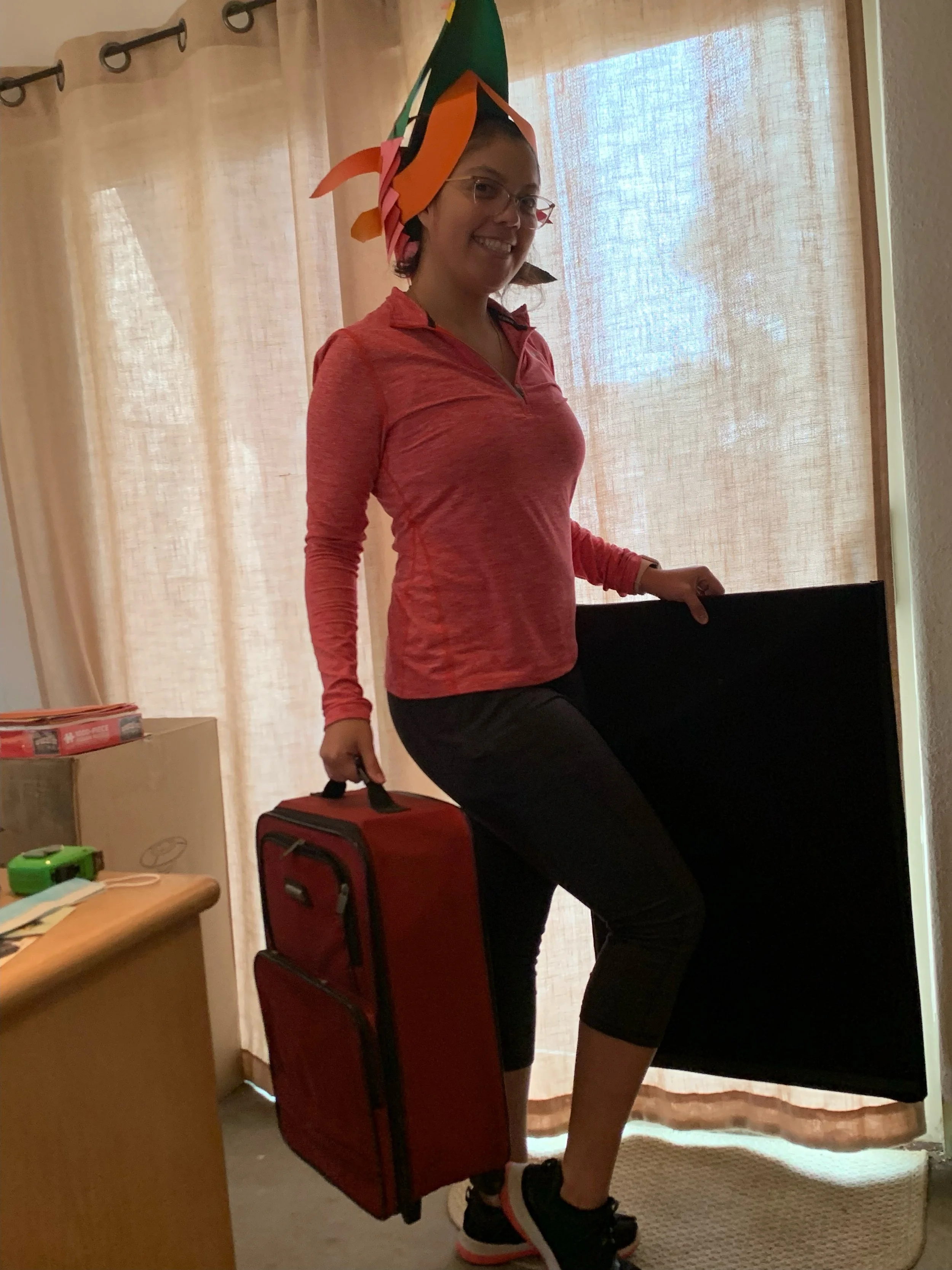 Kayla with prep suitcases.jpeg