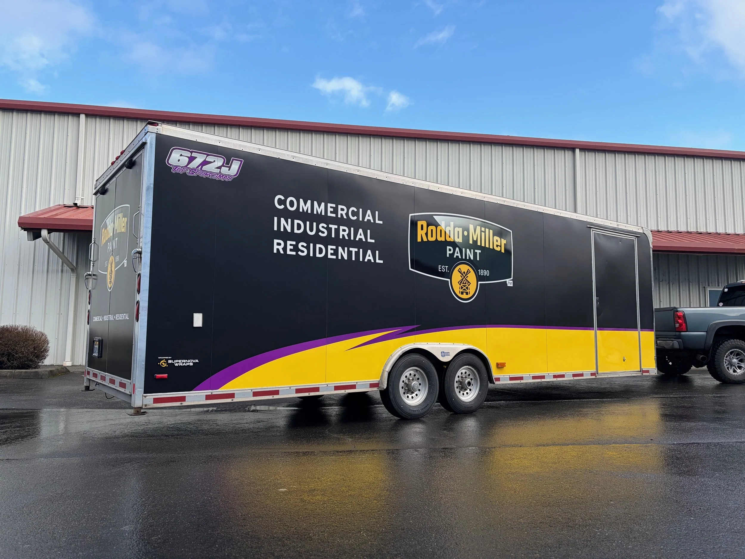 white trailer wrapped full satin black with printed Rodda miller graphics