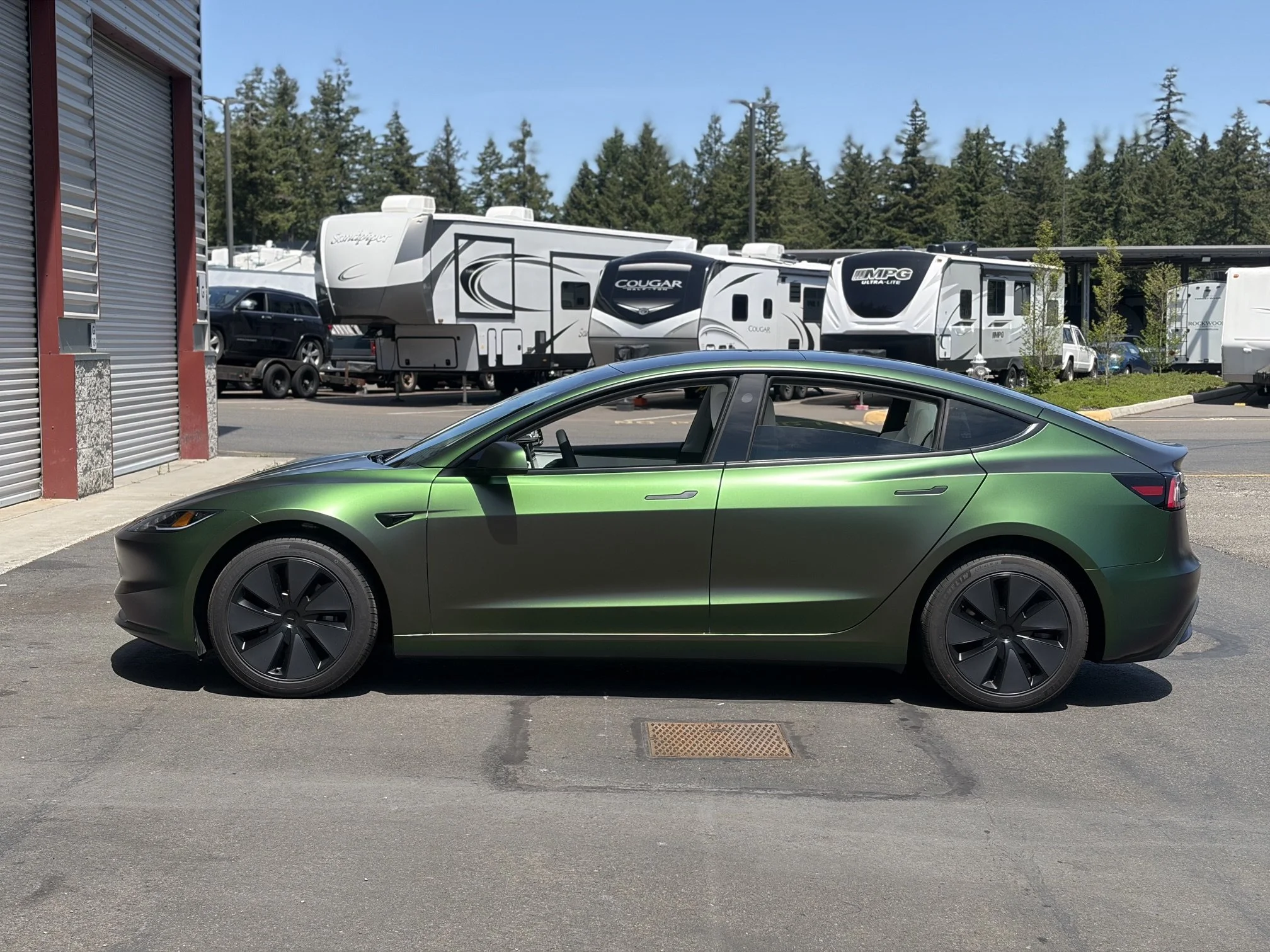2025 Tesla wrapped from white to Satin Urban Jungle