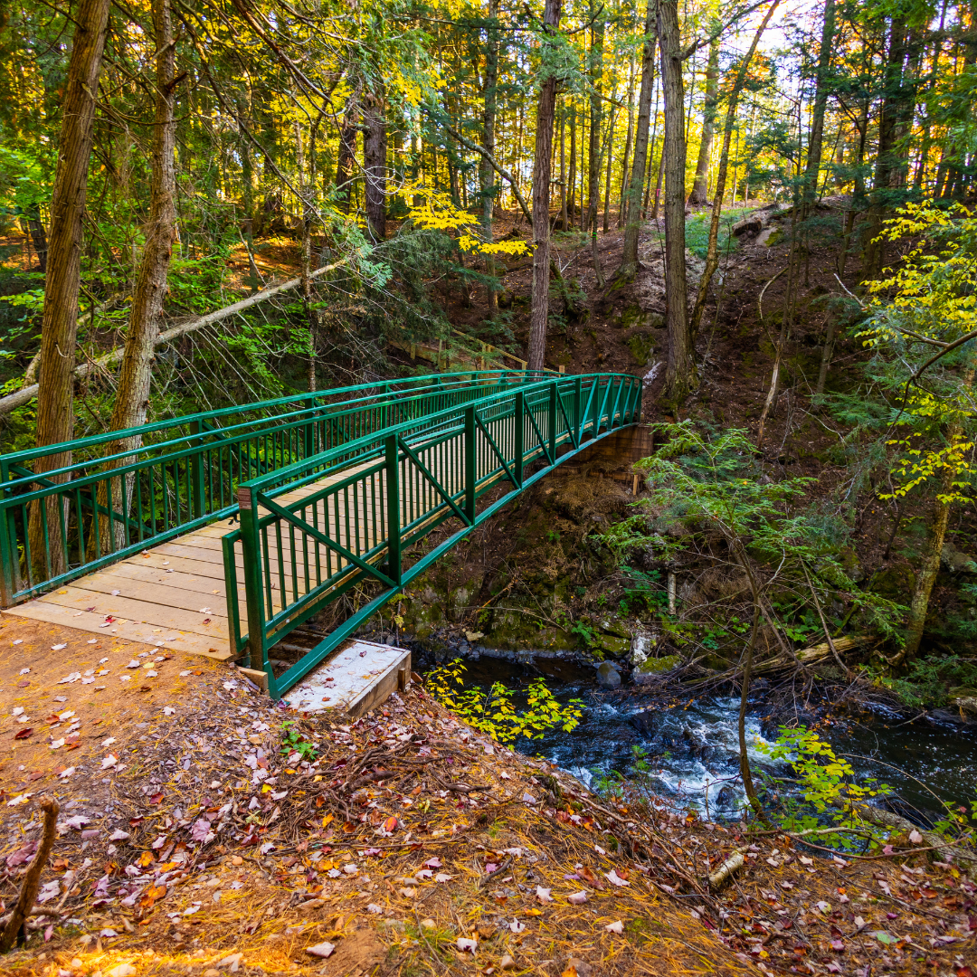 Green bridge over the Carp River at Raging River Resort in Marquette, Michigan