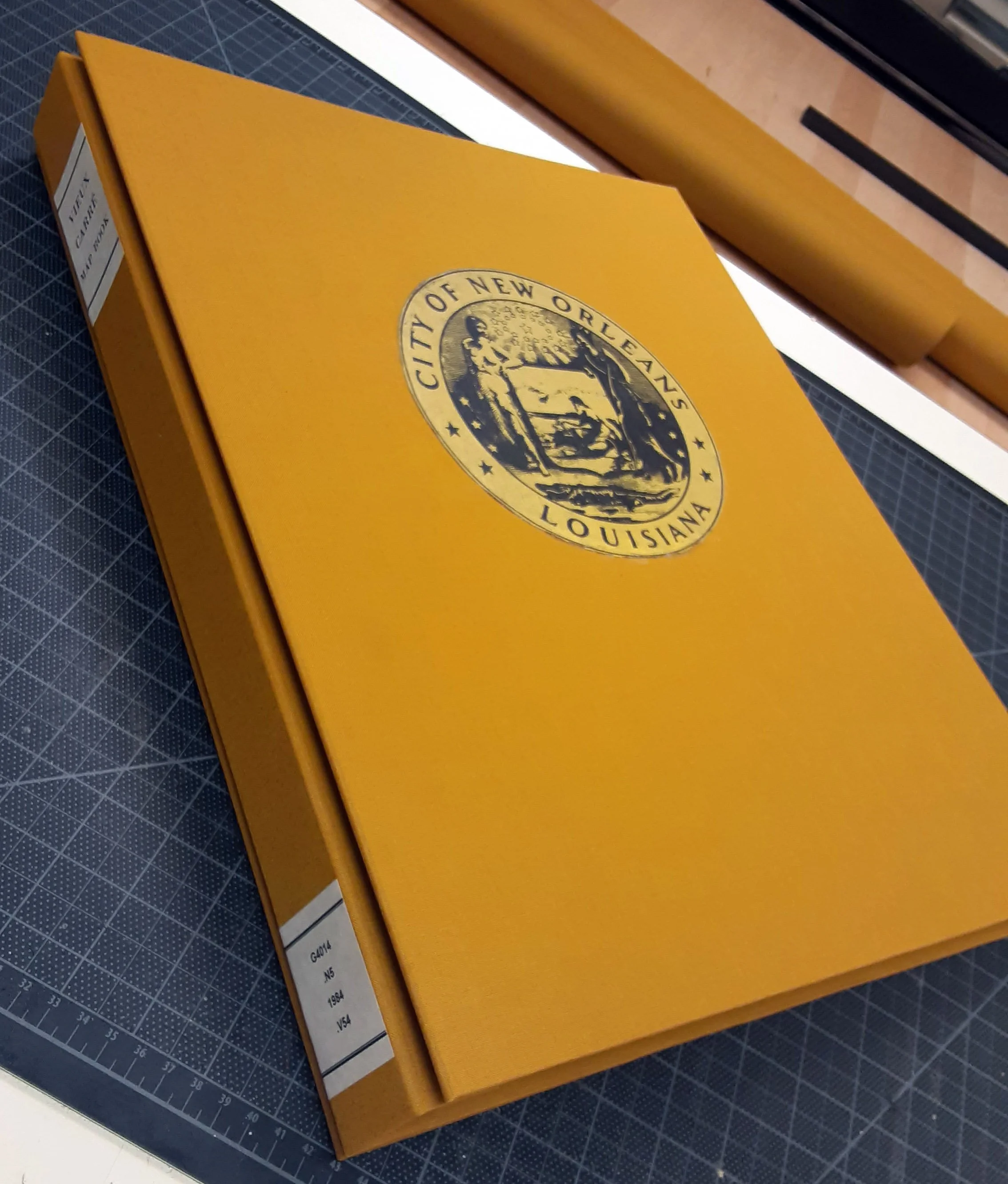 Oversized cloth-covered hard back with original label
