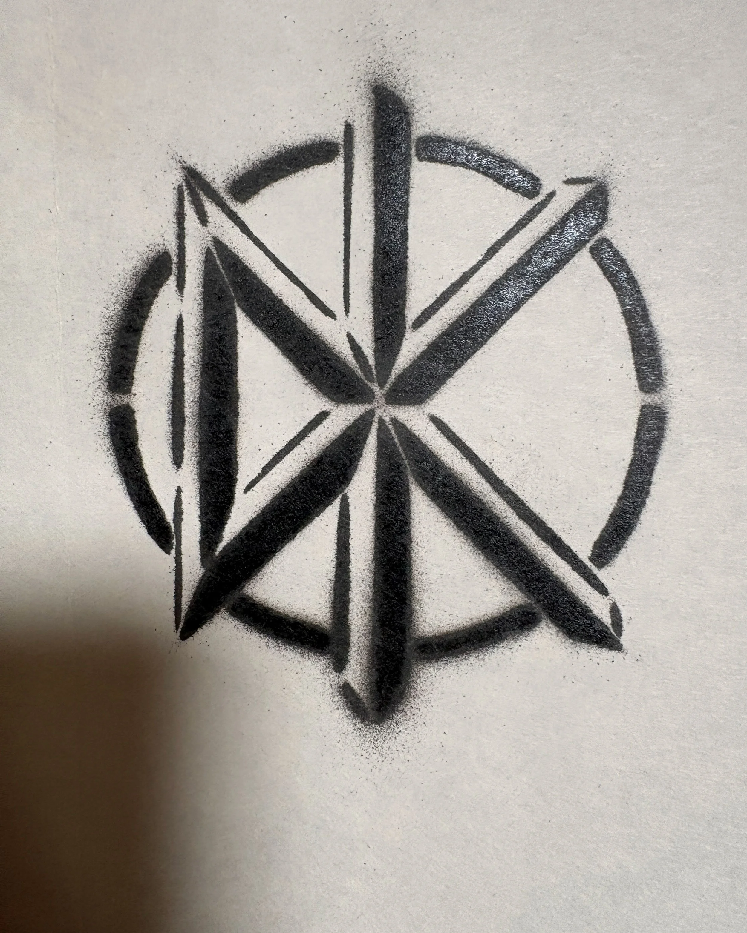 This is the first stencil version I made of the DK logo.  It's about 3 inches across.