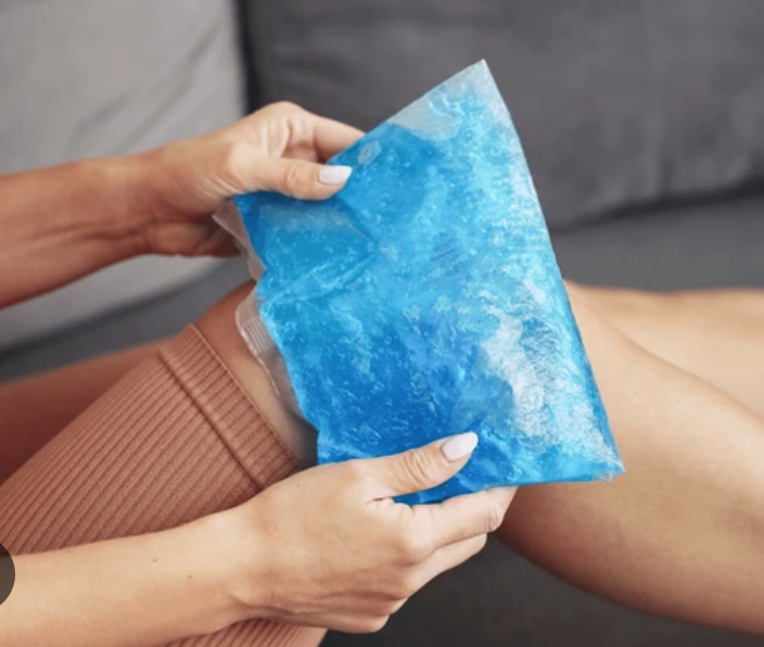 Applying ice to reduce pain and inflammation after a sports injury
