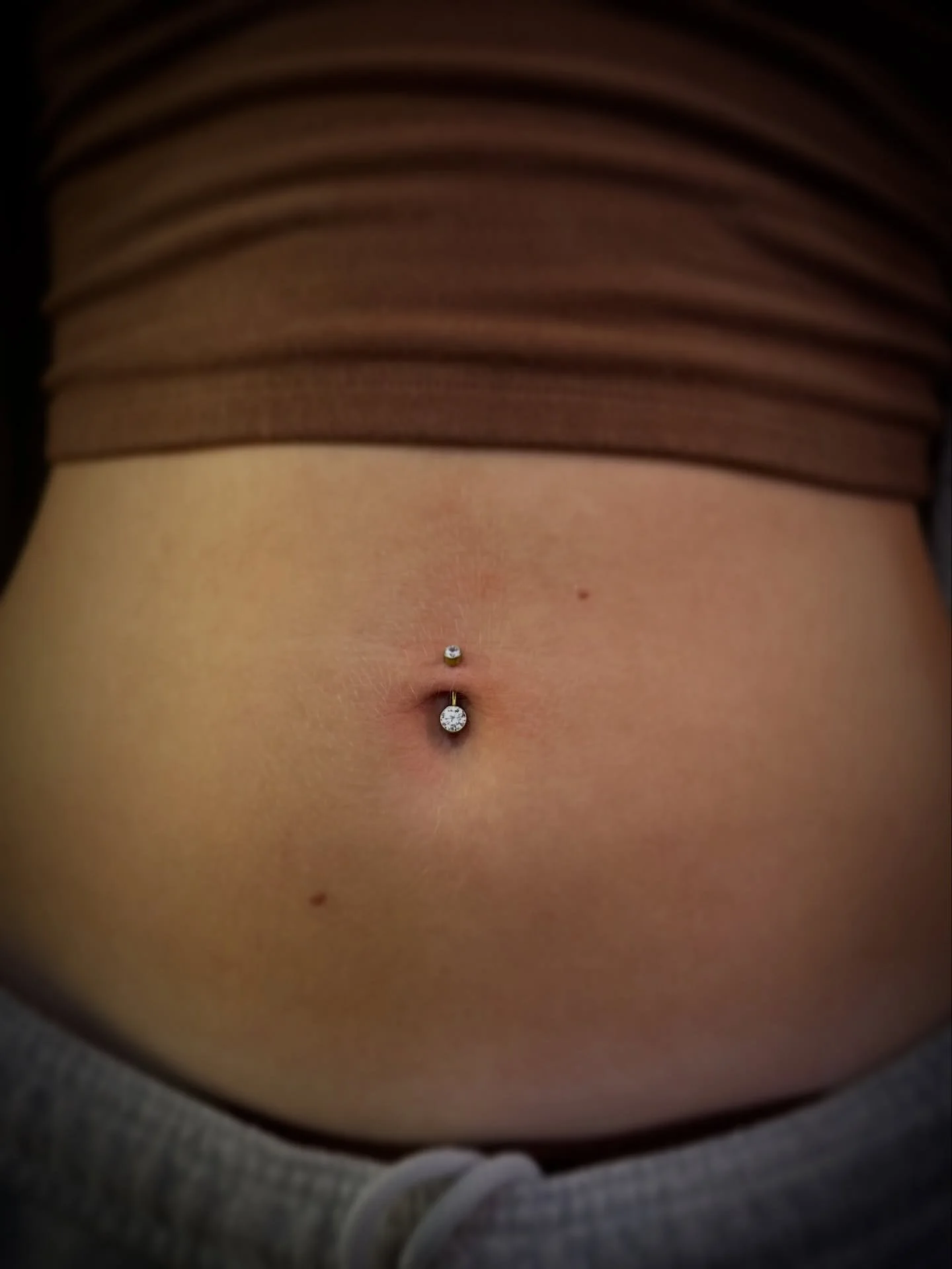 A timeless classic ✨

This traditional navel piercing features one of our most popular belly button jewelry styles, custom anodized in gold for that rich, warm finish. It&rsquo;s the perfect blend of bold and elegant - made to catch the light (and co