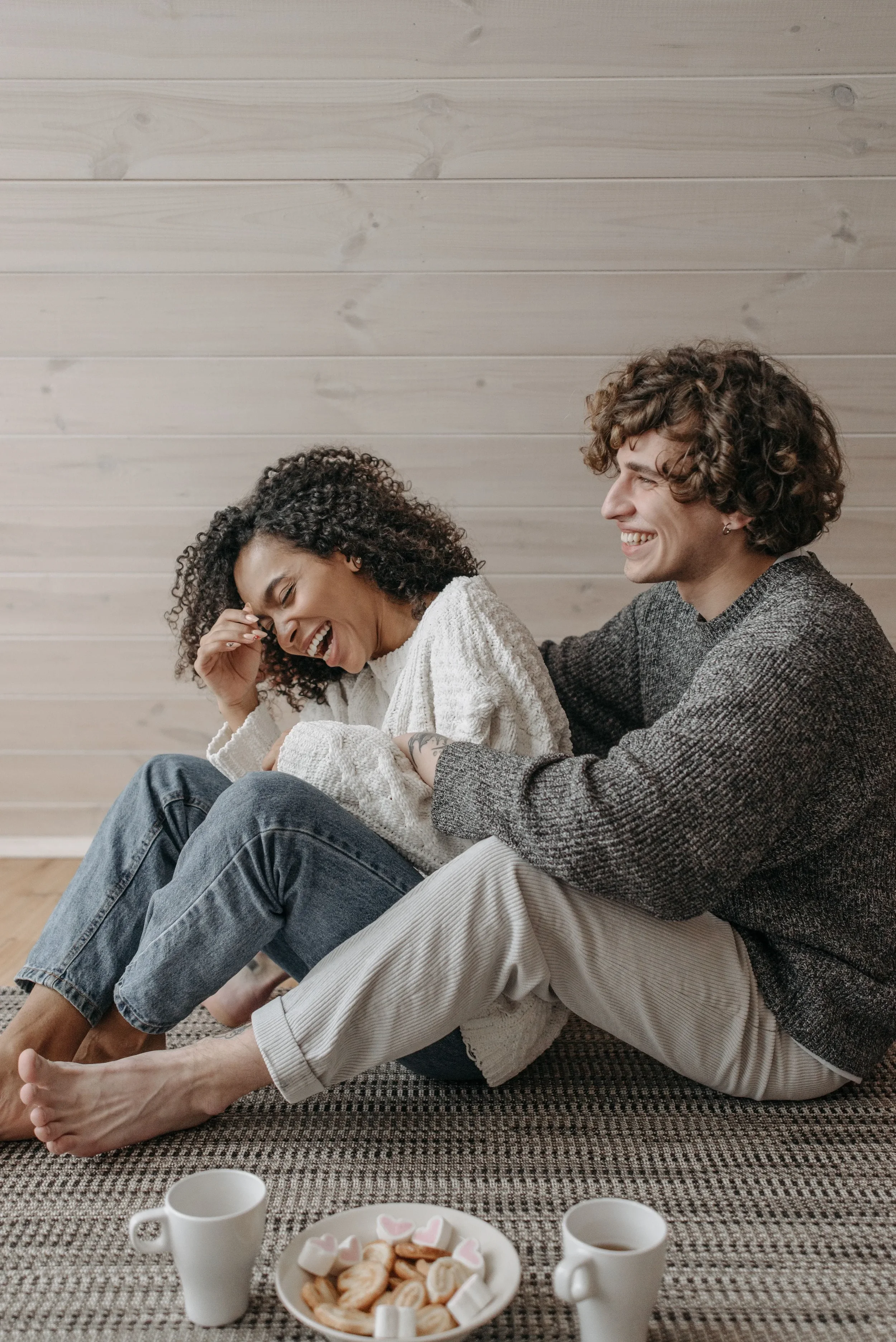 Couple reconnecting after couples therapy giggling