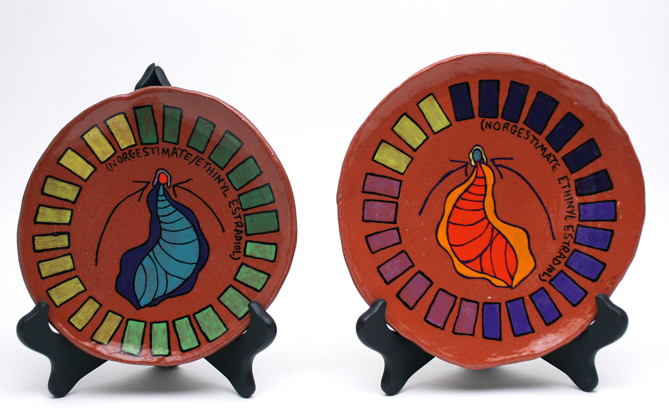 Birth Control Plate Series (clit-tastic) celebrates 20 years of using the Norgestimate Ethinyl Estradiol pill. Each plate centers a vulva with arrows pointing toward the differently colored clitoris.