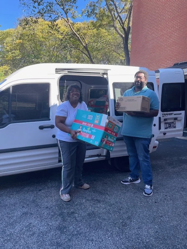 Aleta and Ryan loading the van for a delivery to the Chattanooga Area Food Bank