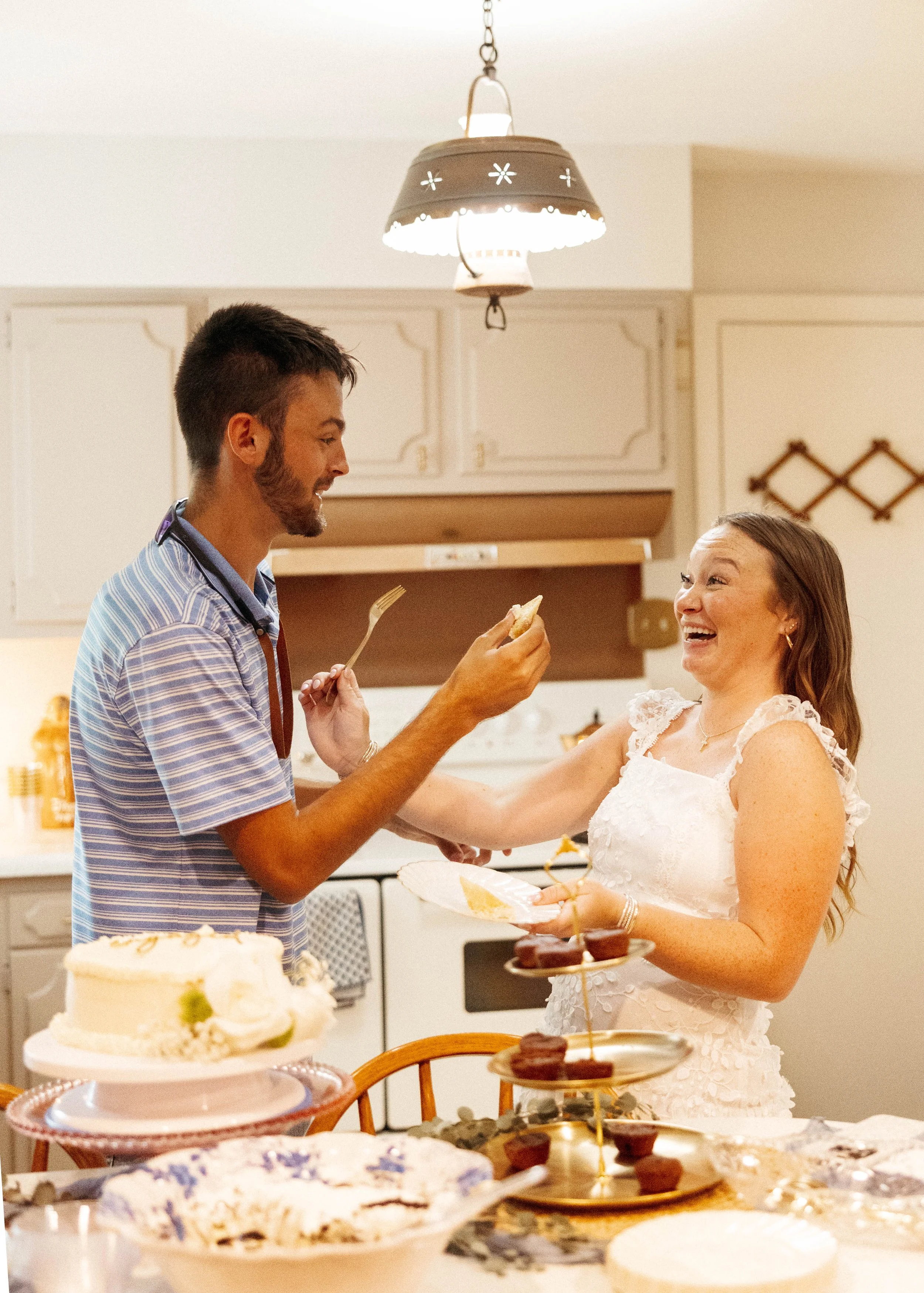 New fiance practicing their cake cutting skills