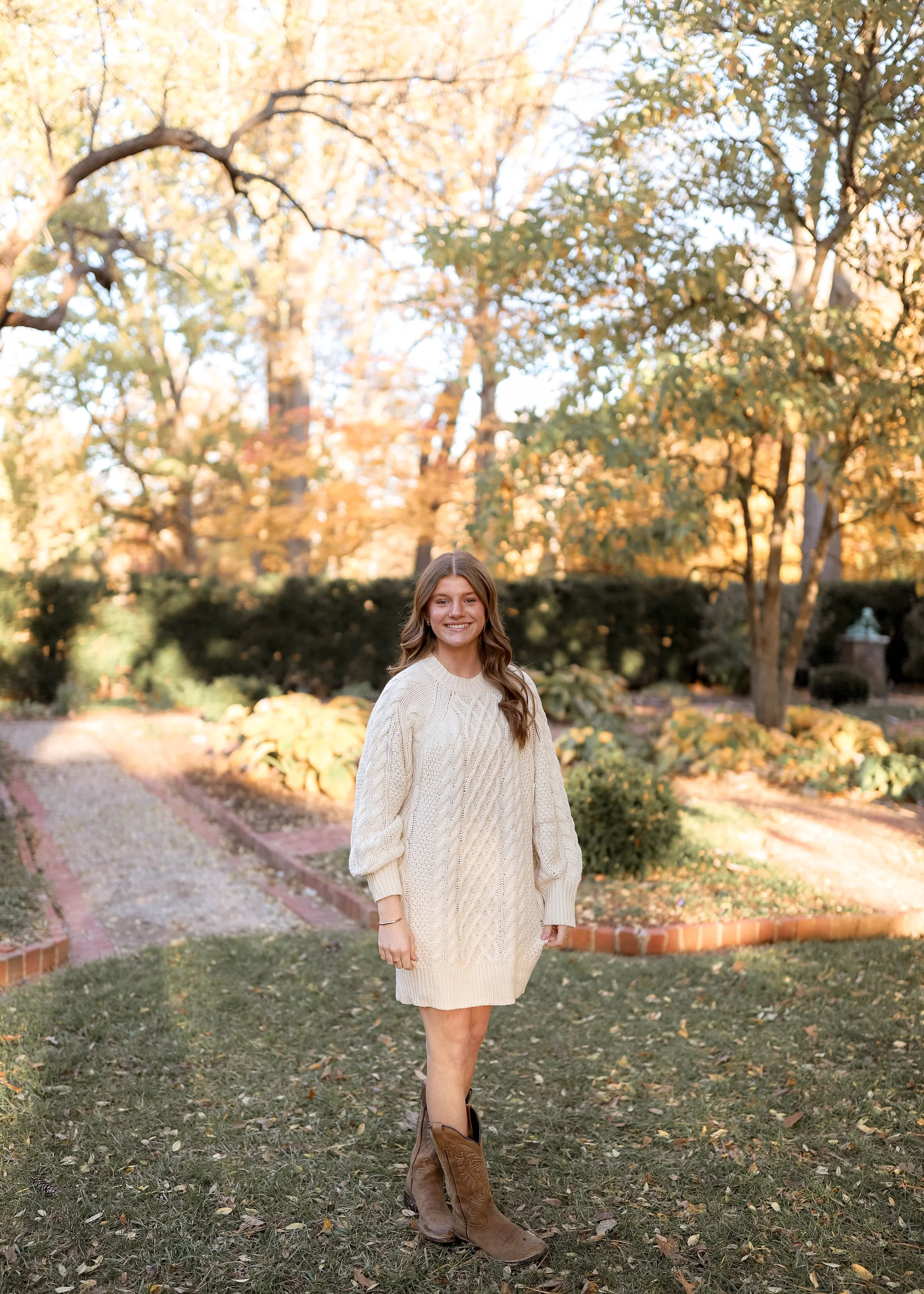 Fall senior pictures at the Henry Clay Estate in Lexington, KY, featuring a senior girl surrounded by colorful autumn trees and gardens