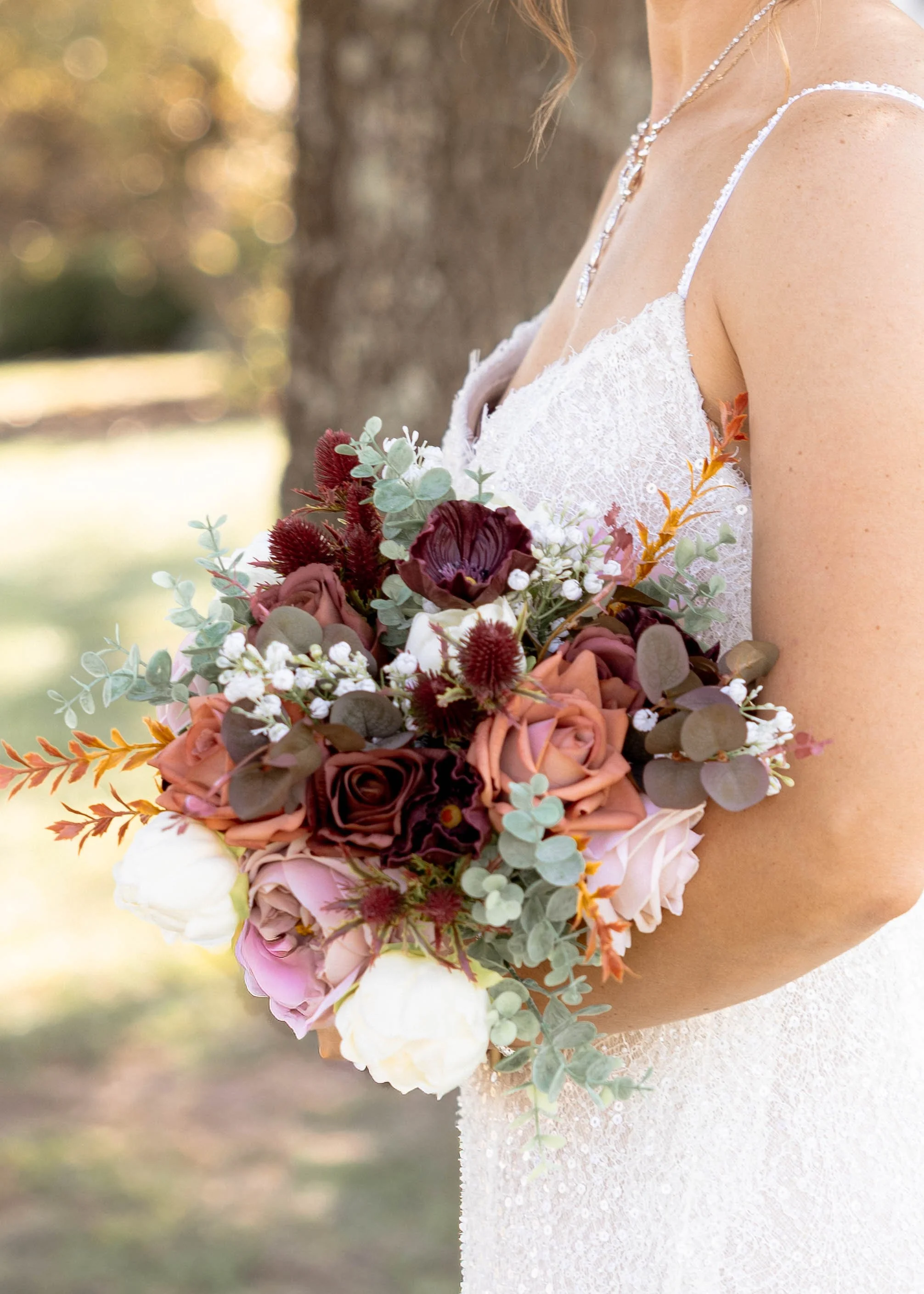 Kentucky bride holding her bouquet of flowers while taking her bridal portraits.