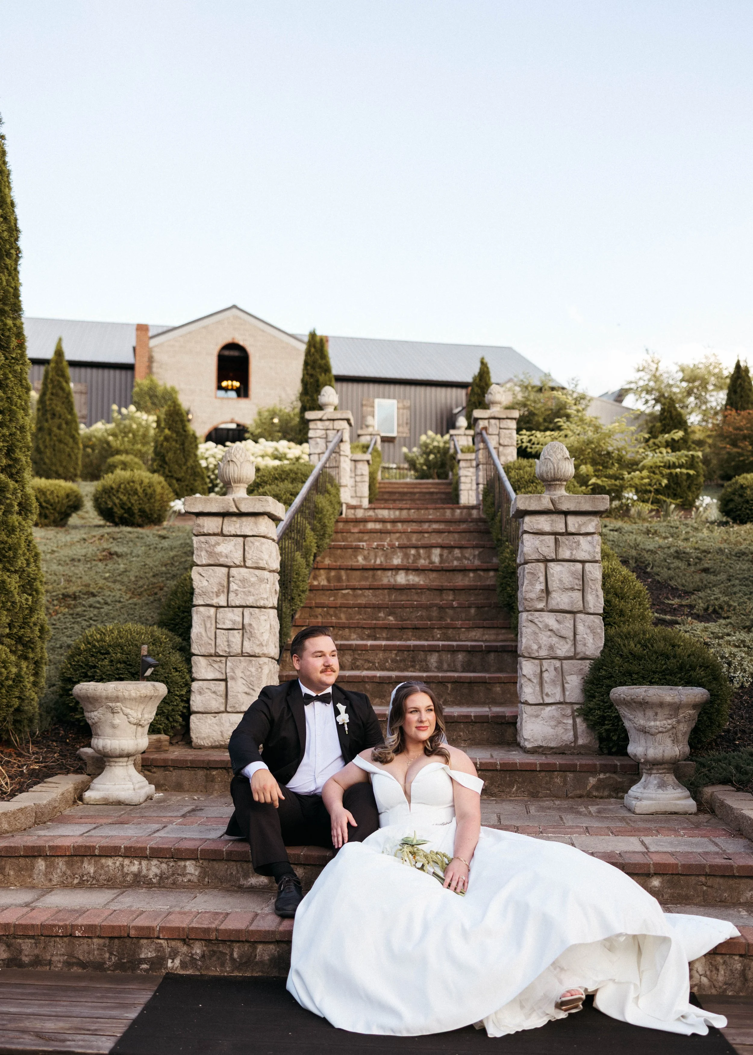 Wedding couple portraits at sunset on a staircase at a Kentucky wedding venue