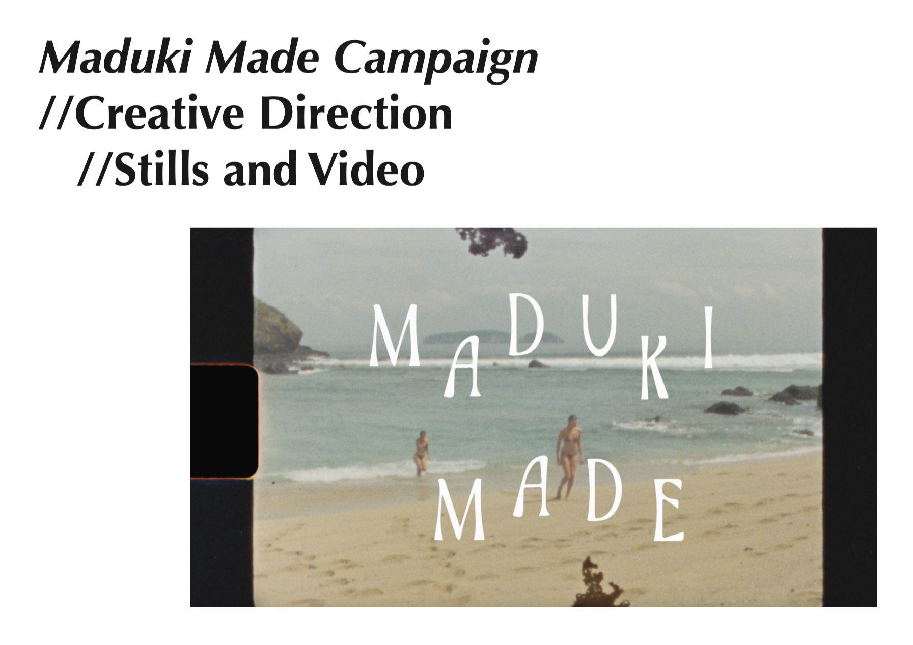 Video frame showing a beach scene with waves, rocks, and two women in swimsuits, with the text "Maduki Made" overlaid.