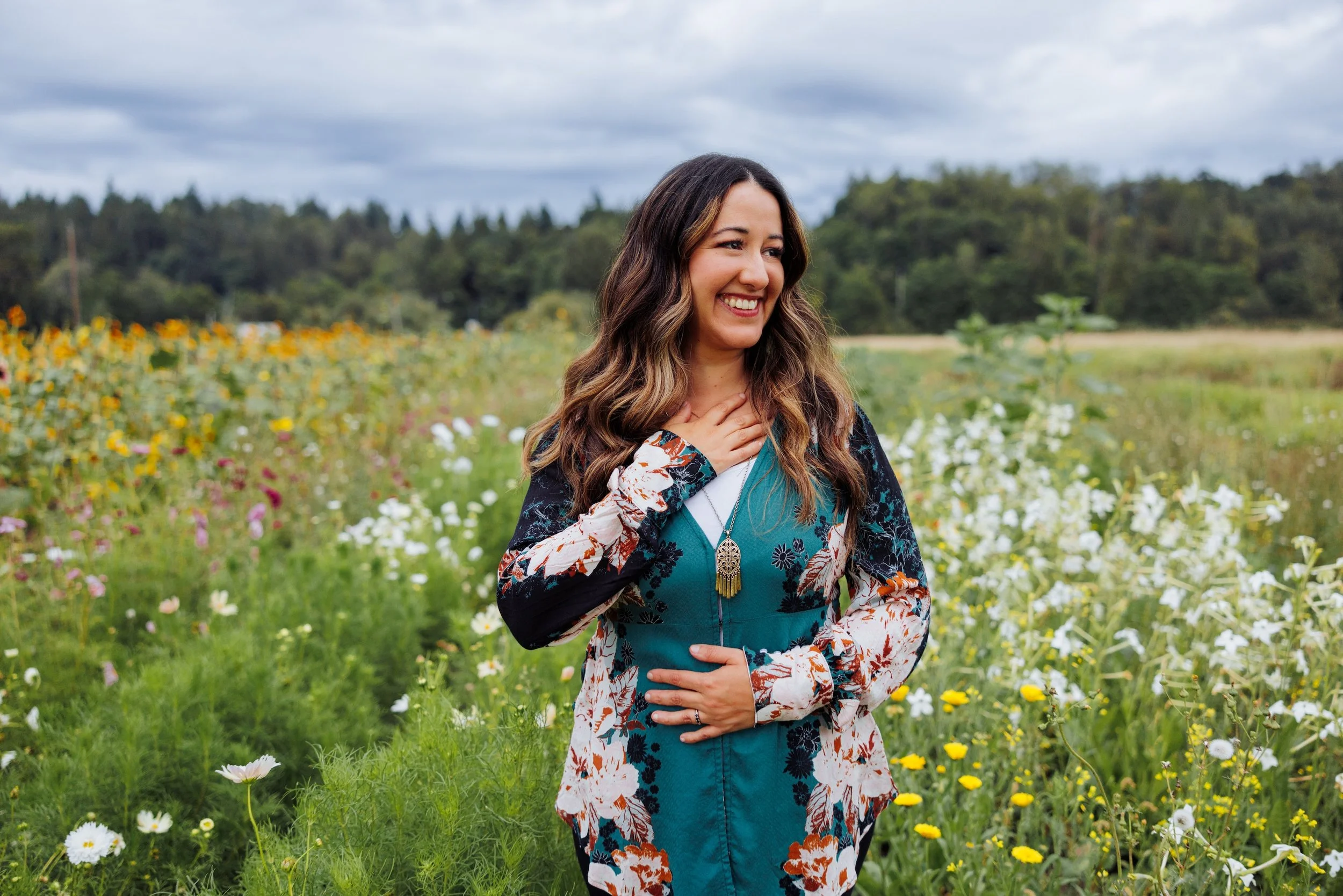 Woman standing in field of wildflowers in the PNW