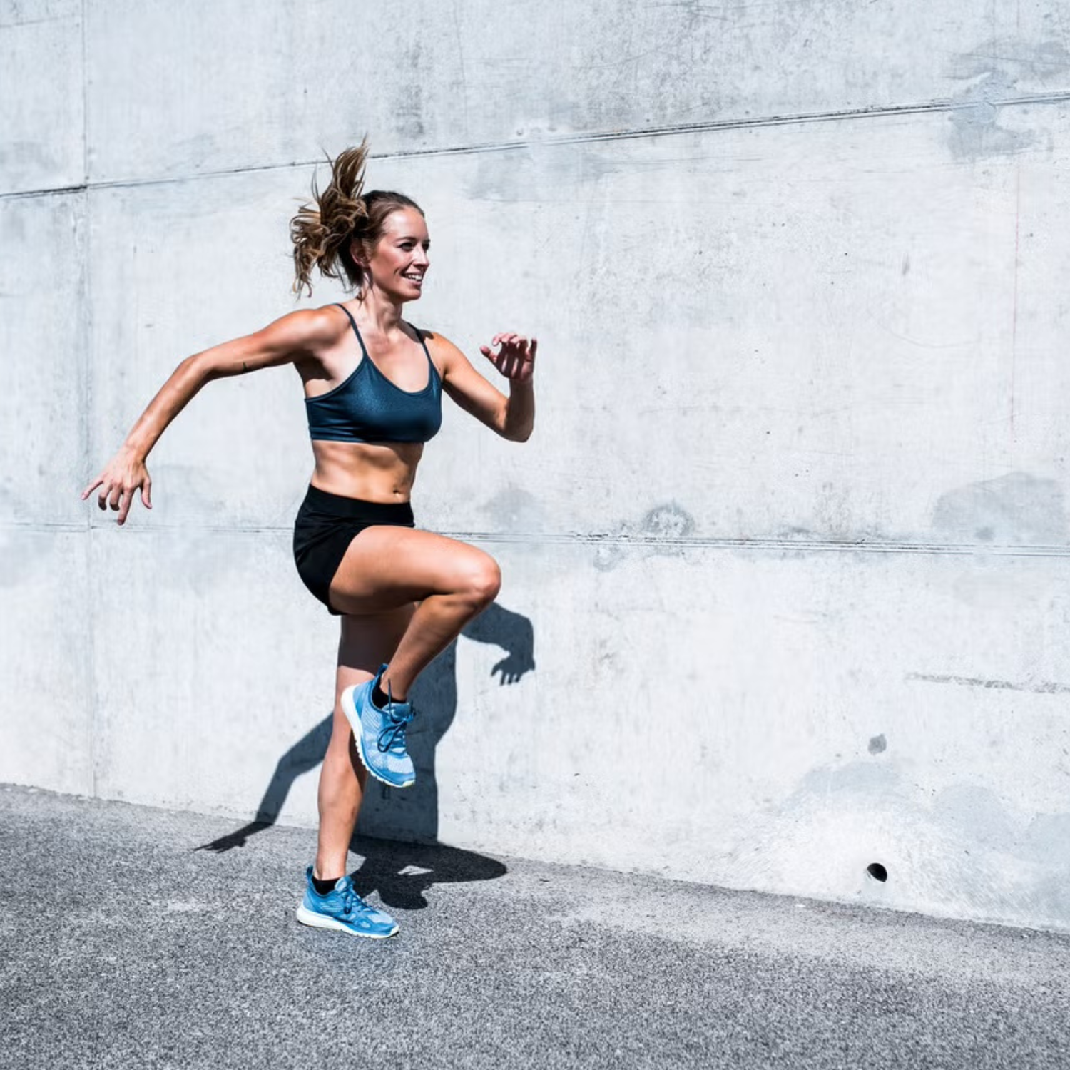 Woman skipping on pavement for exercise