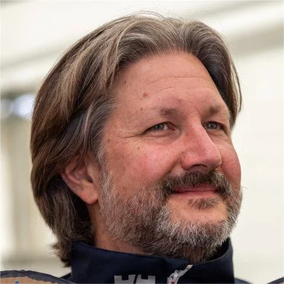 Smiling person with short hair