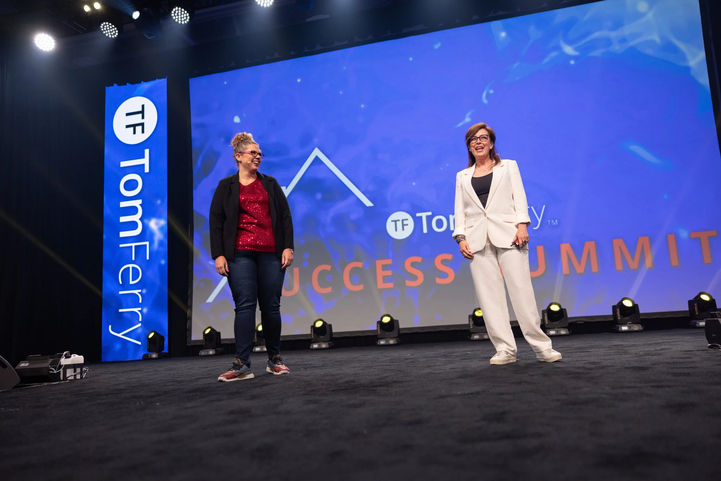 Janet Miller on stage at a real estate industry event