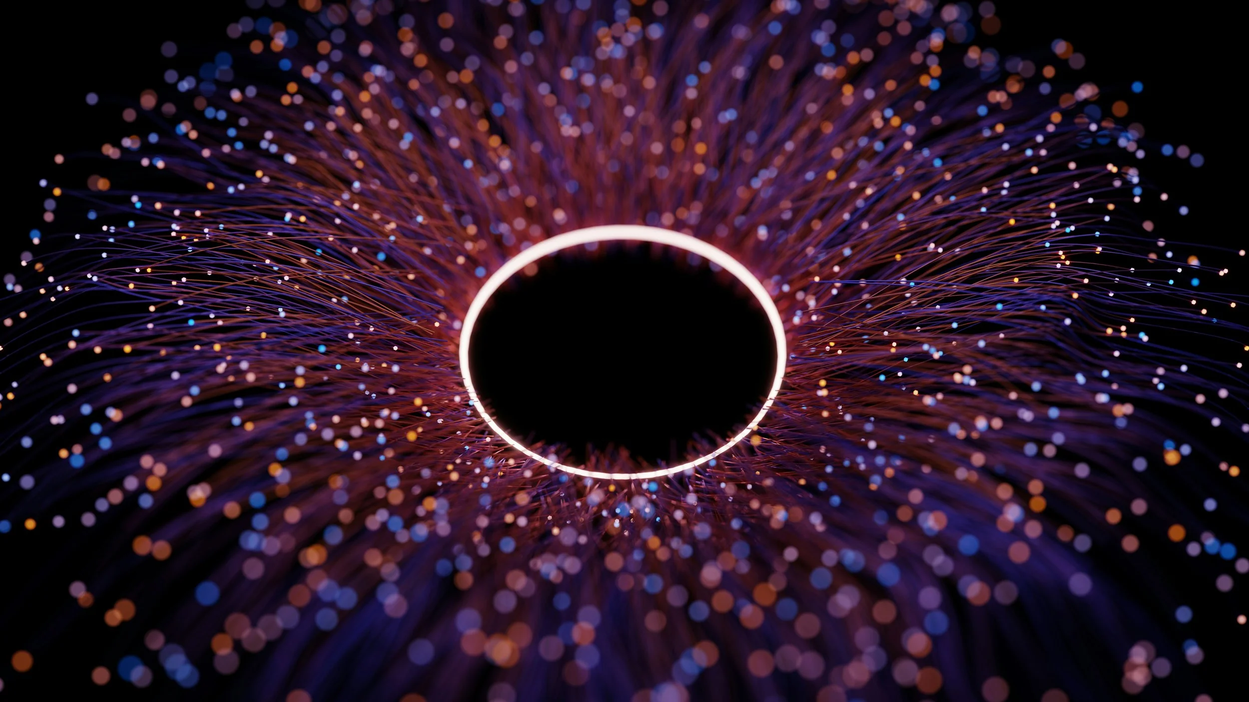 Abstract digital artwork showing a glowing white ring at the center, surrounded by radiating purple and orange light trails and bokeh-like dots on a dark background.