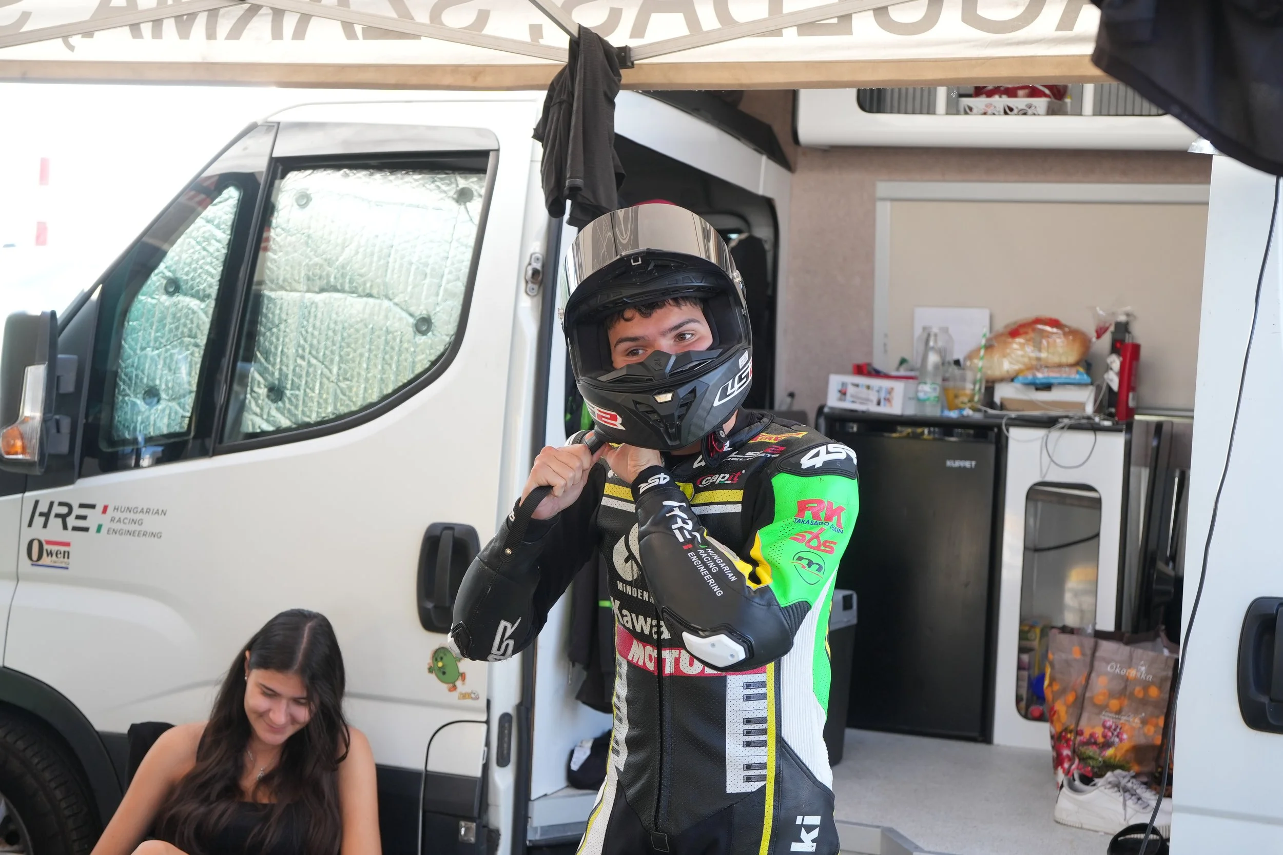 Lukács Owen putting on his LS2 Thunder GP-Pro helmet