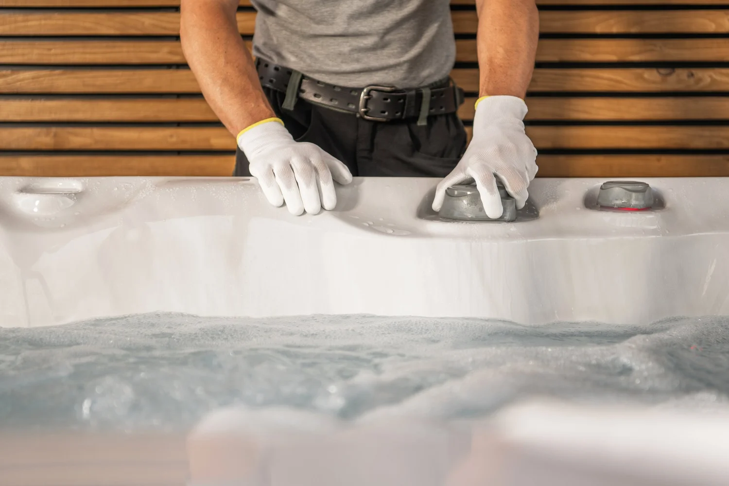 Technician checking hot tub equipment