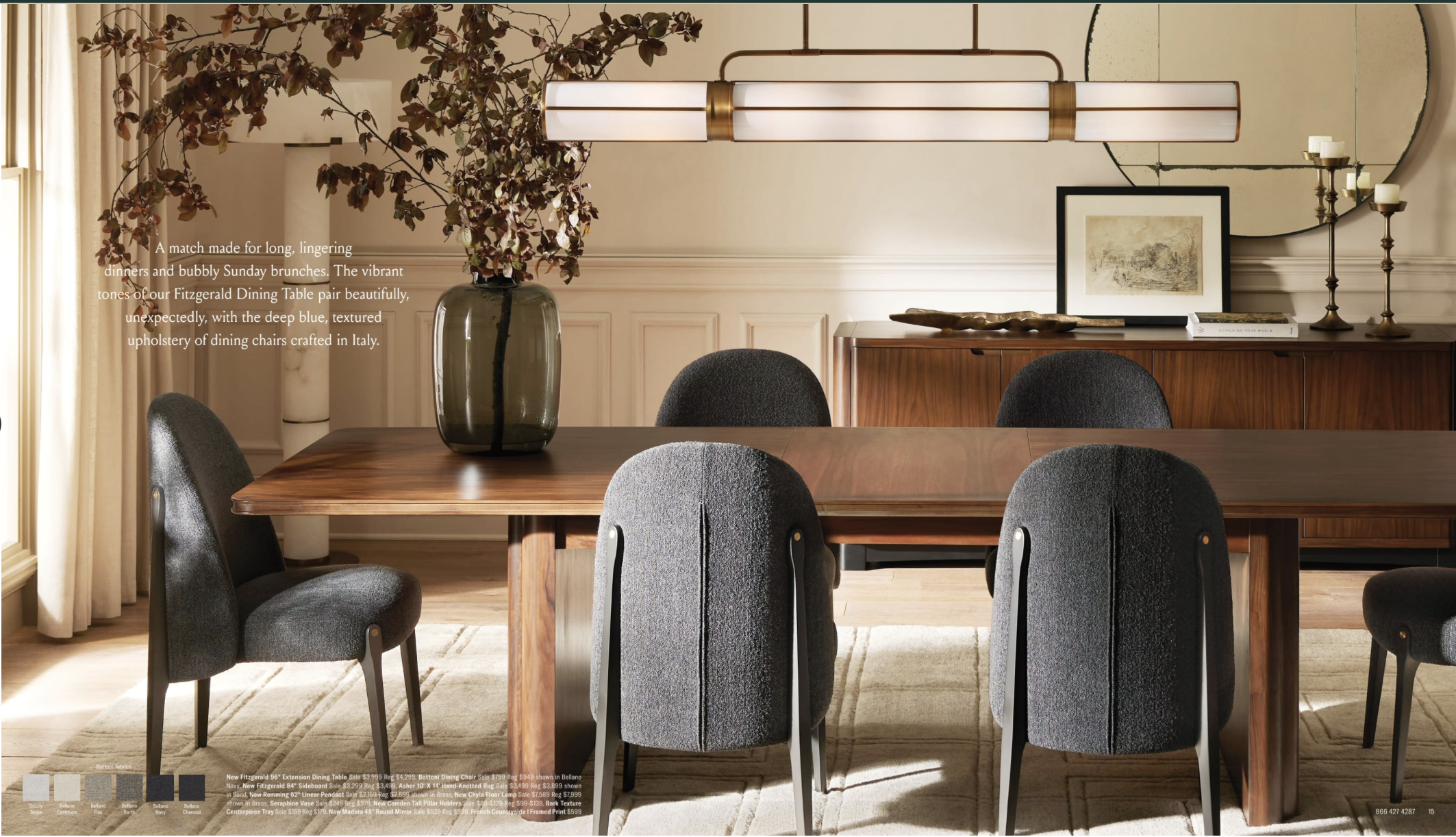 Arhuas 2024 Fall Catalog -- photo shows a dining room scene with upholstered grey chairs and a low profile large wooden dining table. there is a large greenery arrangement on the left half of the table, and a modern pendant lamp hangs above.