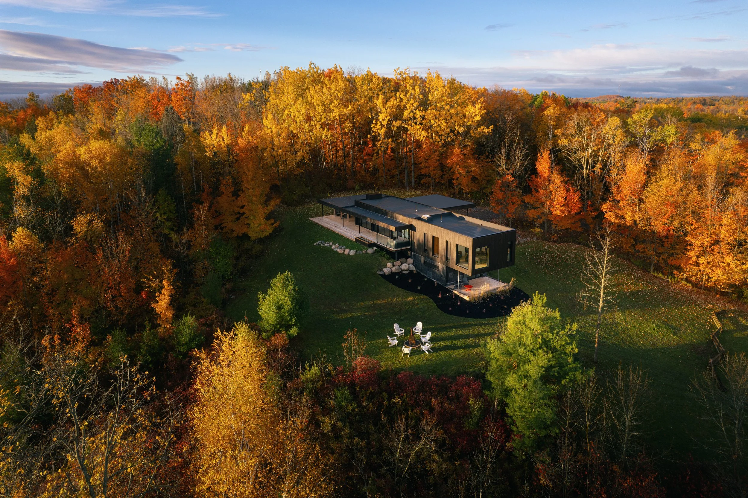 Aerial view of house and surrounding landscape