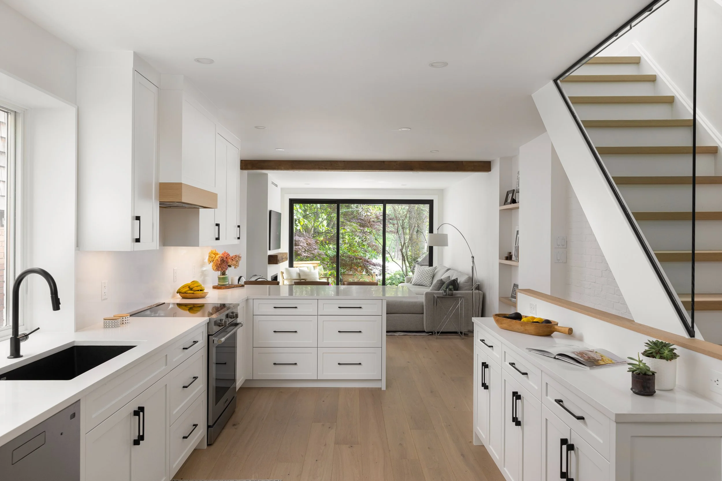 A bright, modern kitchen with open concept living room