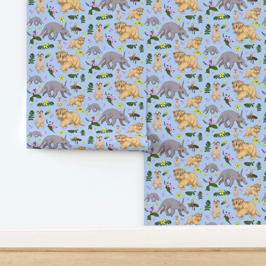 Illustration featuring aardvarks, meerkats, leopard cubs, bees, and flowers on a blue background.