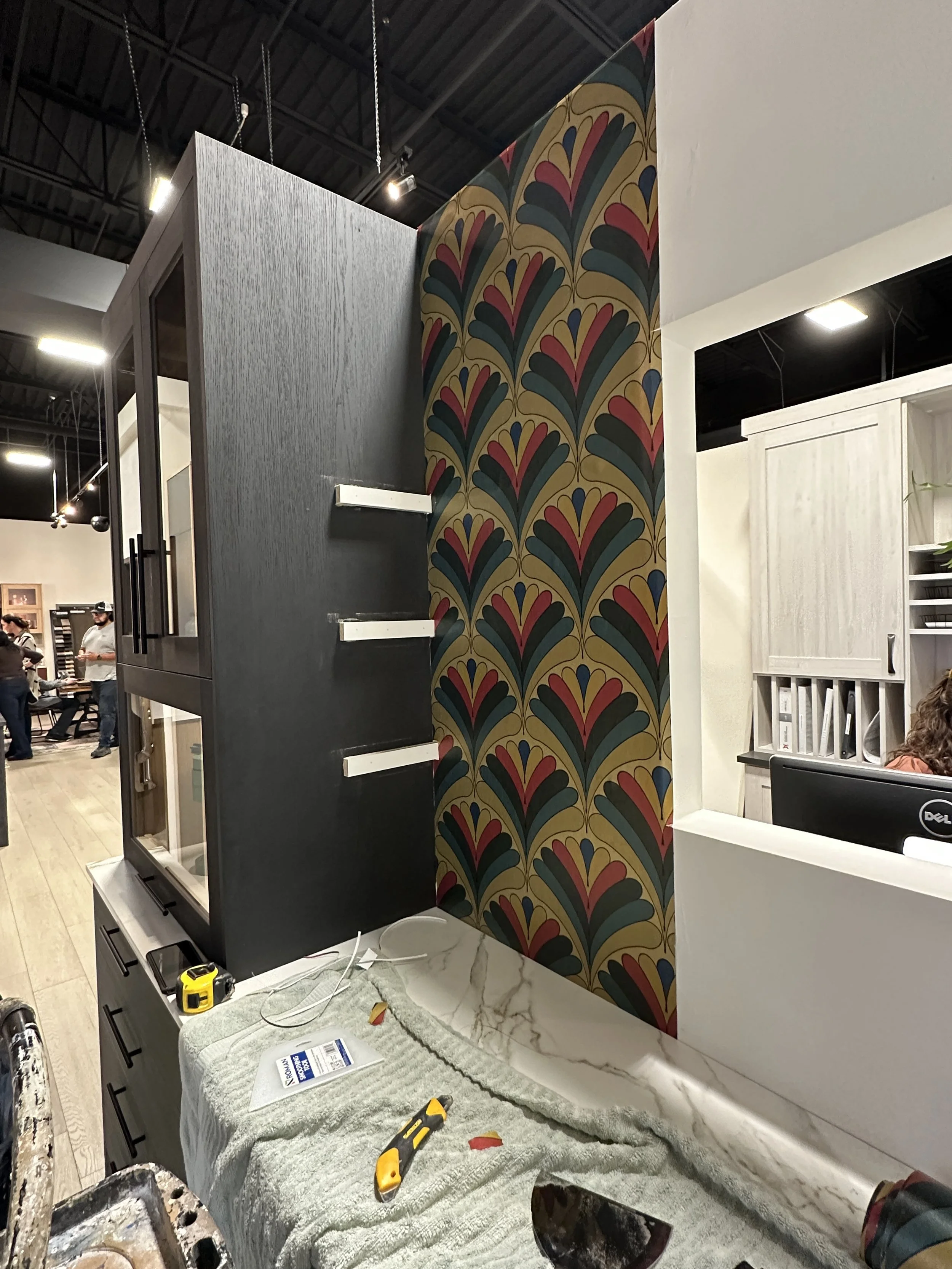 The first roll is applied
Textured gold metallic wallpaper that adds both color and elegance to the space