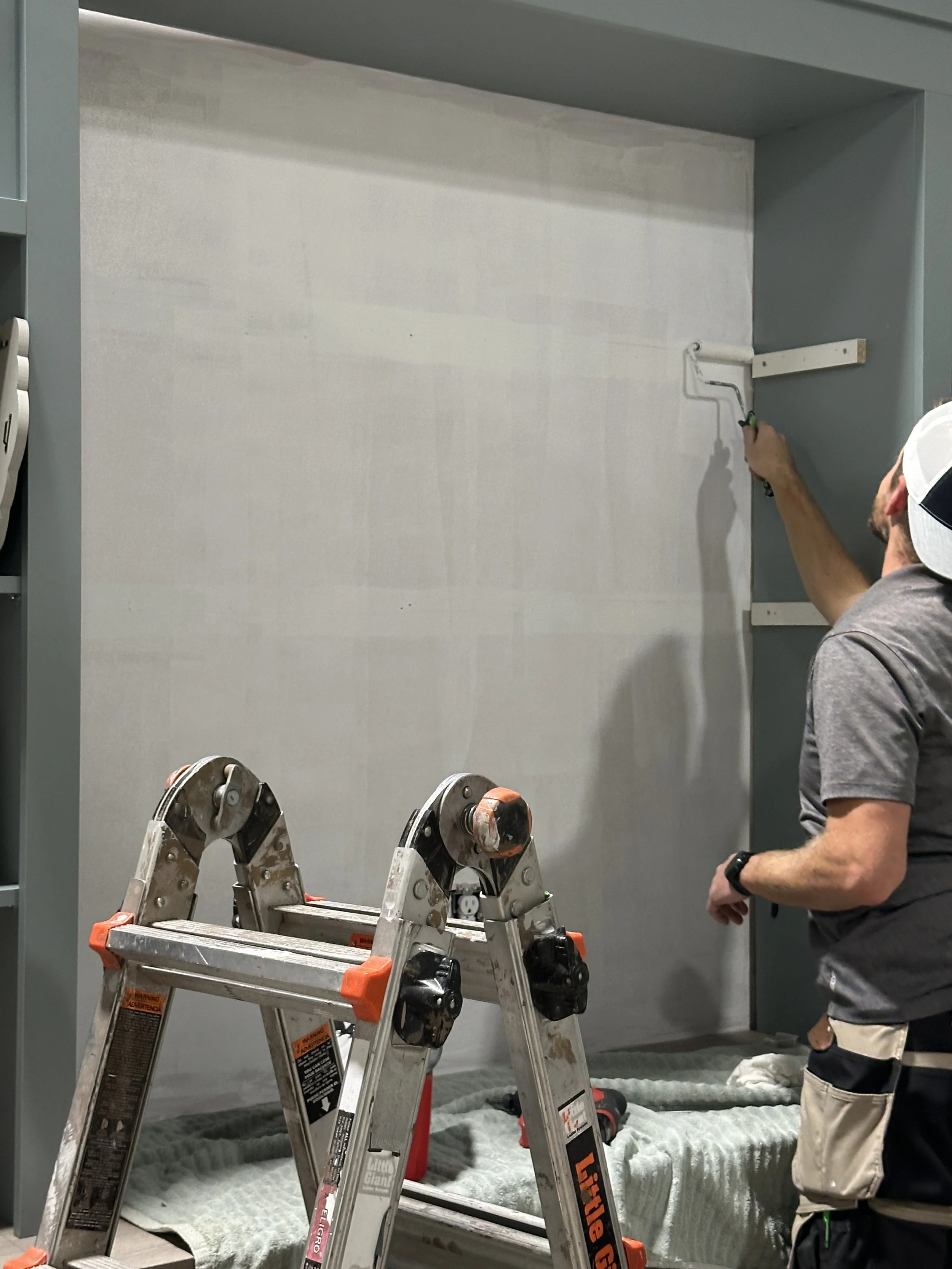 Josh applies the first coat of primer