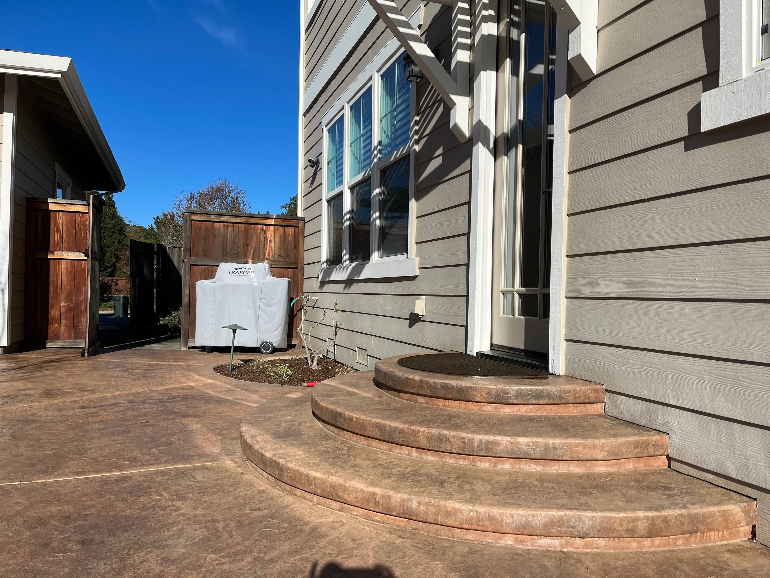 Rounded stamped concrete steps and patio in Fountaingrove, CA.