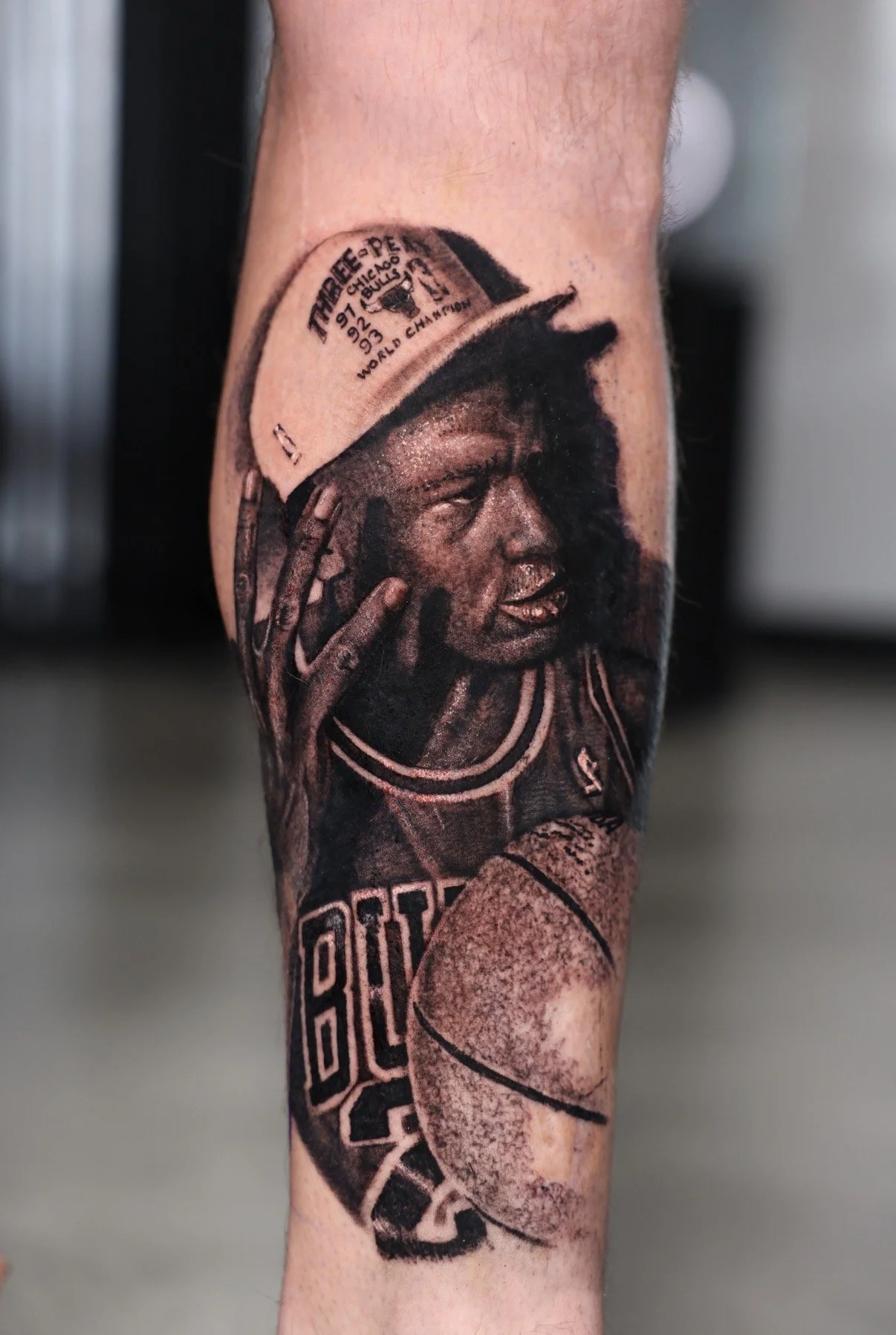 tattoo of michael jordan, realistic black and grey portrait.