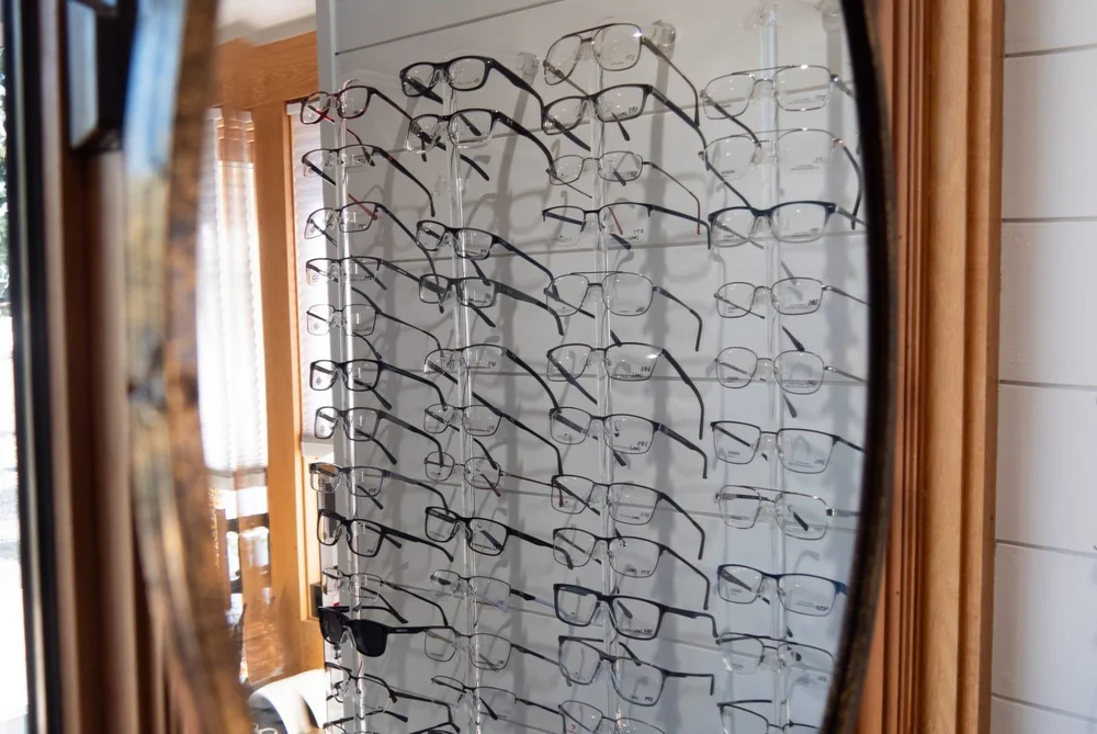 Eyeglass frames reflected in a mirror at Anderson Family Vision in Bozeman