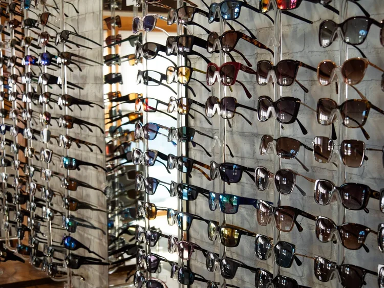 Wall of name-brand sunglasses at Anderson Family Vision in Bozeman
