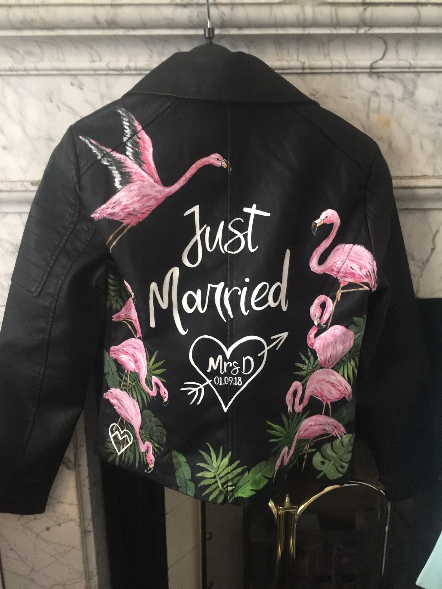Her custom made leather jacket with "Just Married" painted on it, was fab we thought.