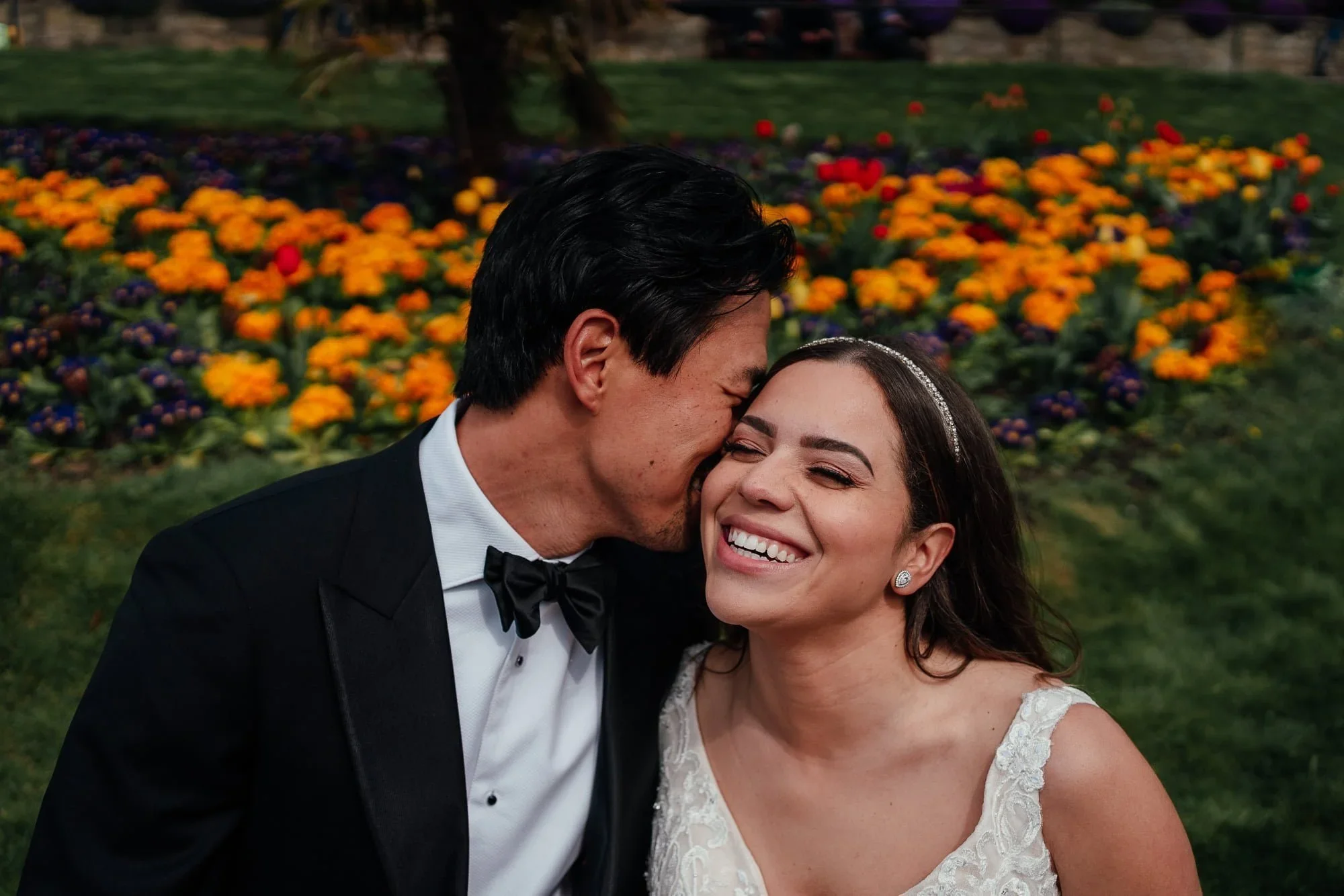 An elopment wedding - Bride and groom snuggle in to each other laughing