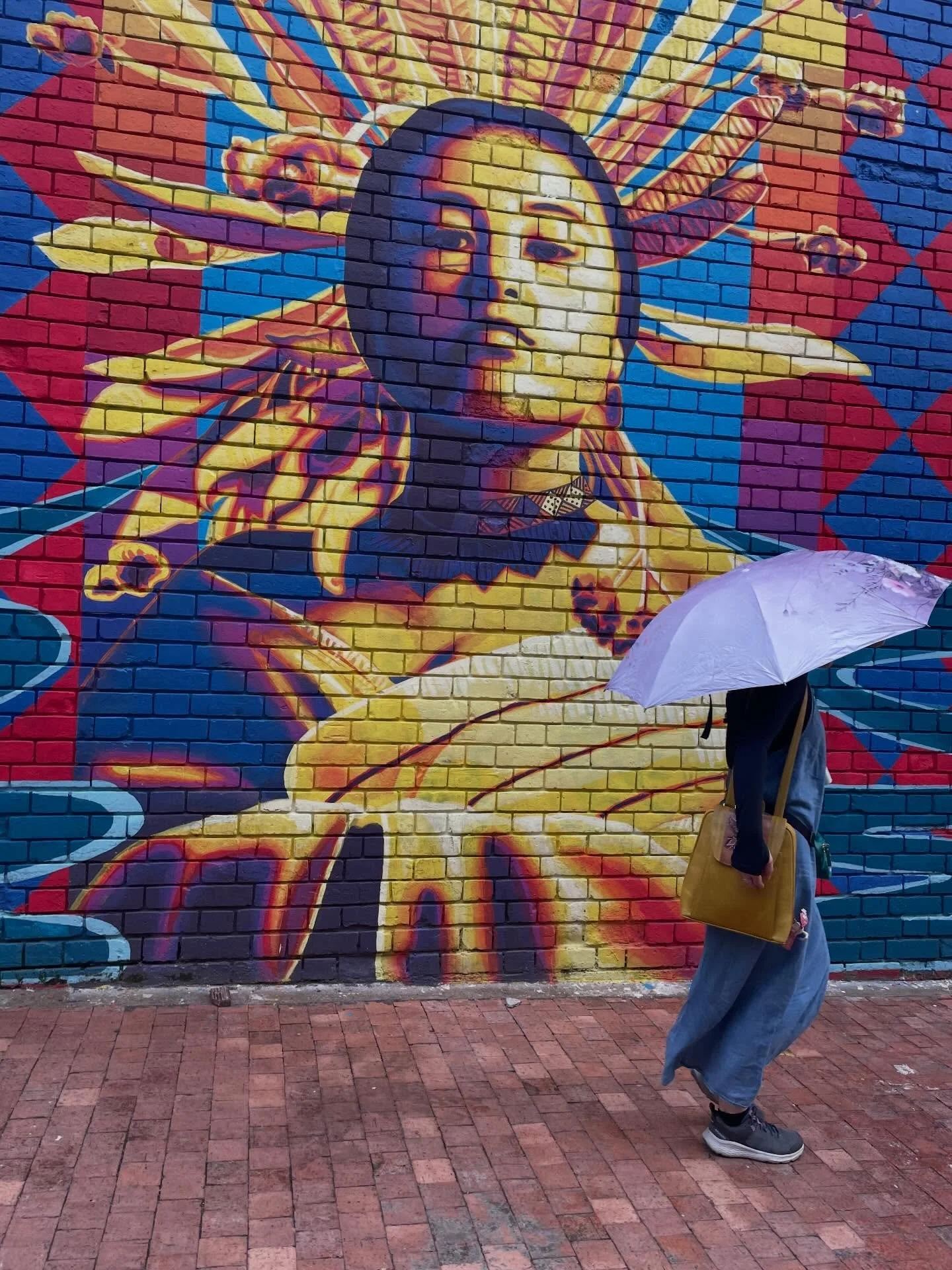 Some of the visual interest in Bogota. Nella is under the umbrella in pic #1. 
#citywalk 
#enjoyingtheview 
#urbanart