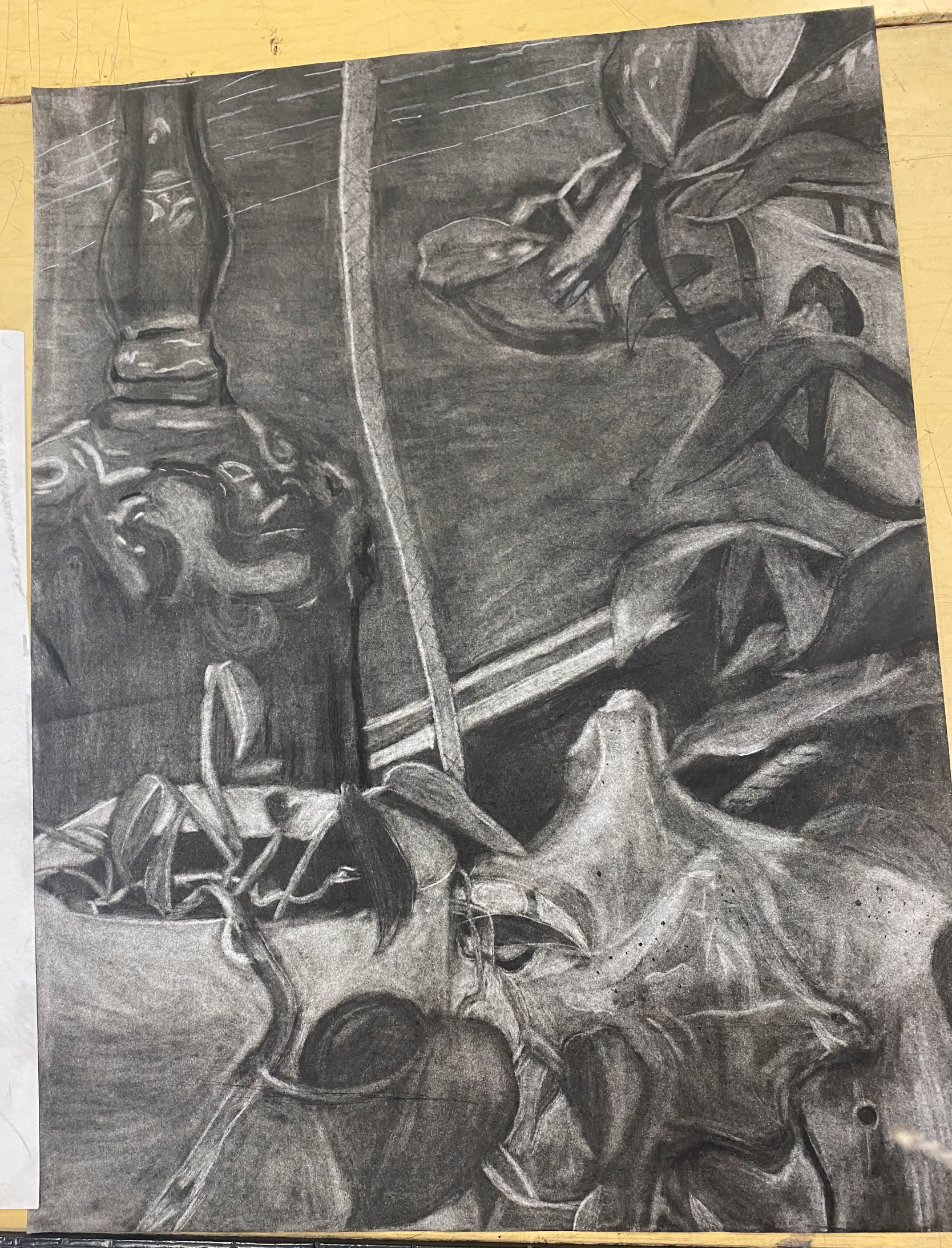 A detailed black and white drawing featuring a chess king piece, leaves, and a wooden surface.