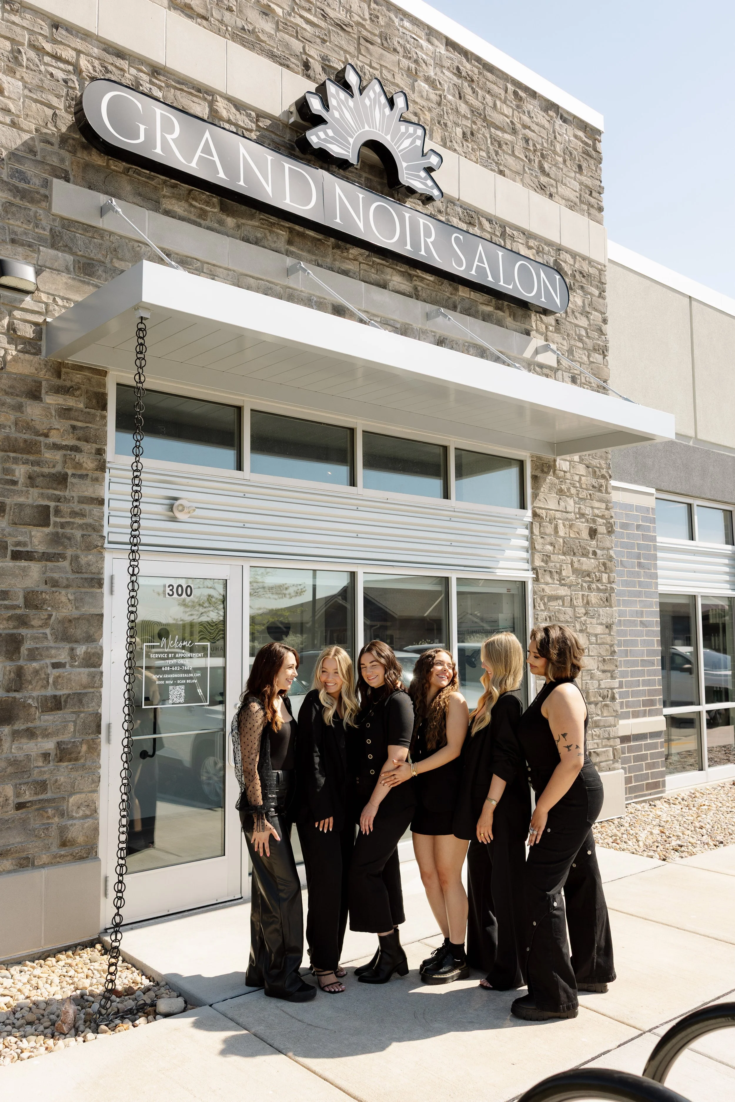 Grand Noir Salon hairstylist team outside the salon in Verona, WI