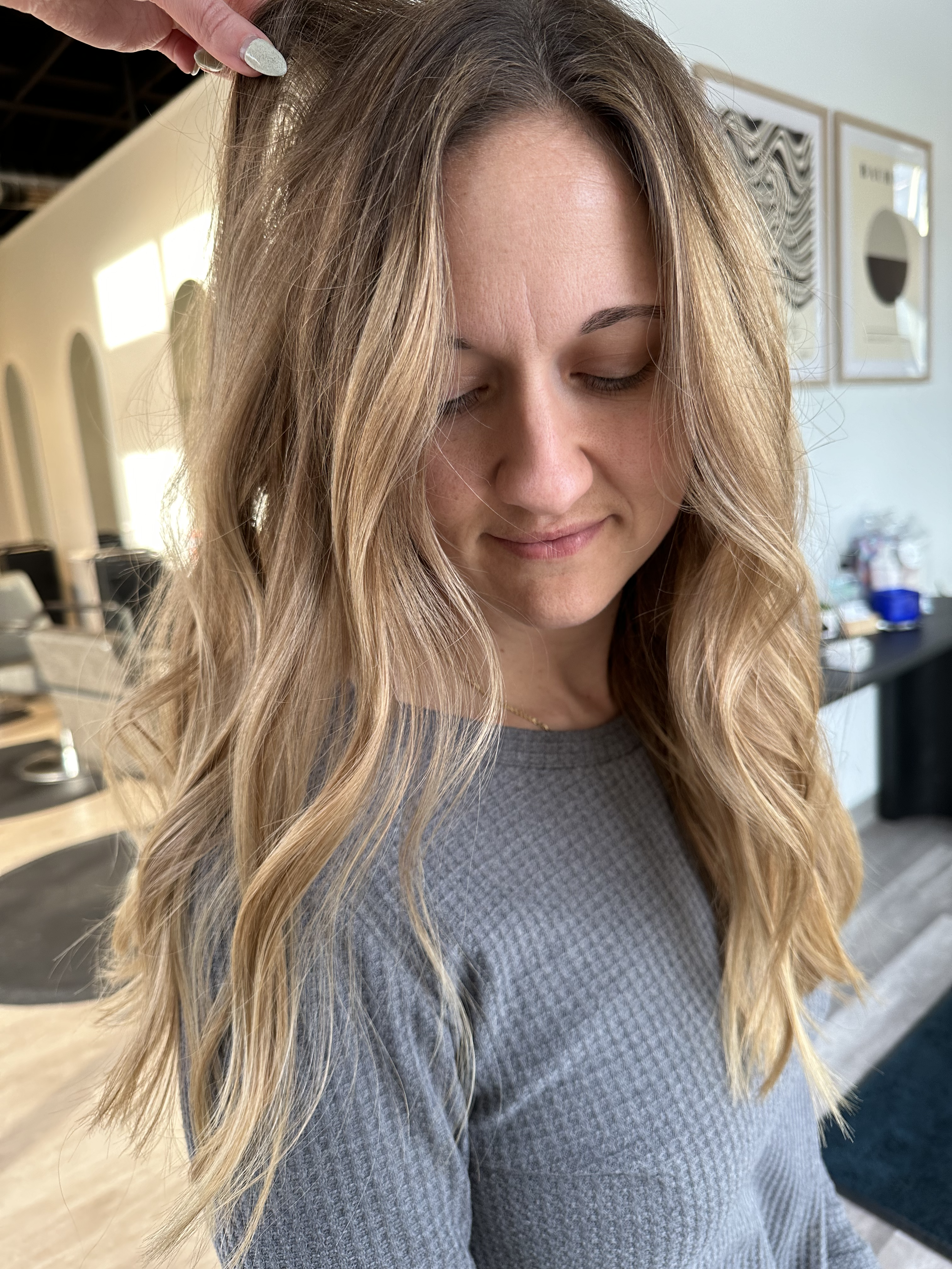 Long lived-in blonde balayage at Grand Noir Salon in Verona, WI