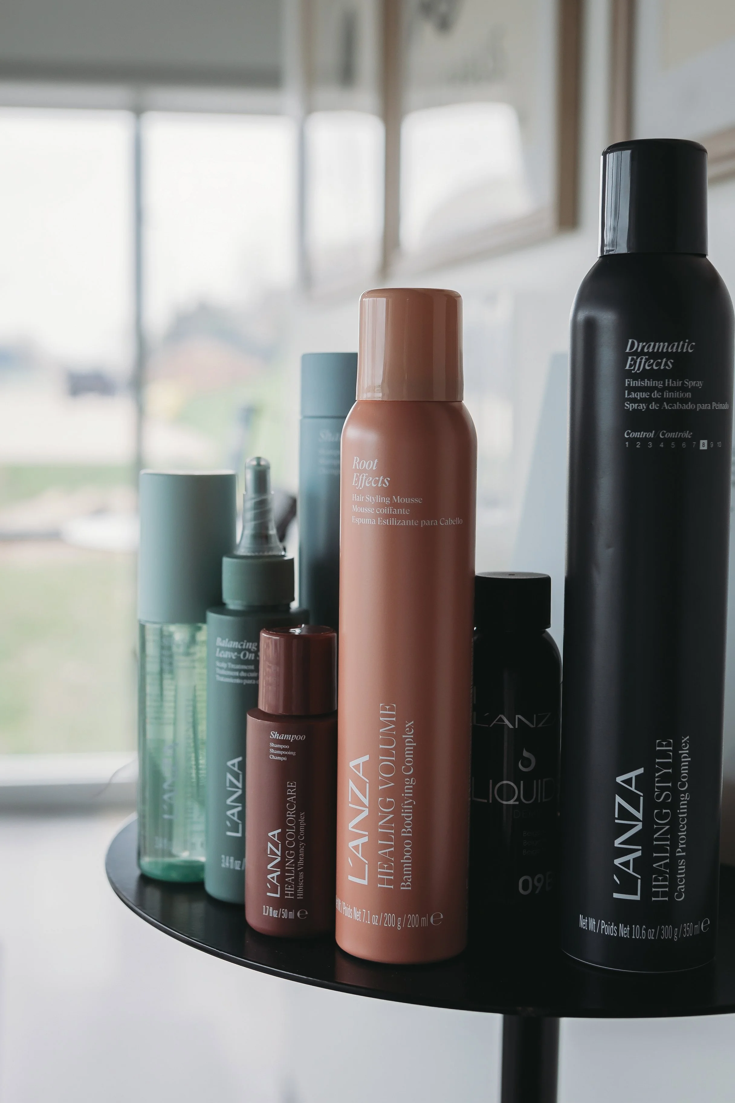 L'ANZA styling products on a display table at Grand Noir Salon in Verona, WI