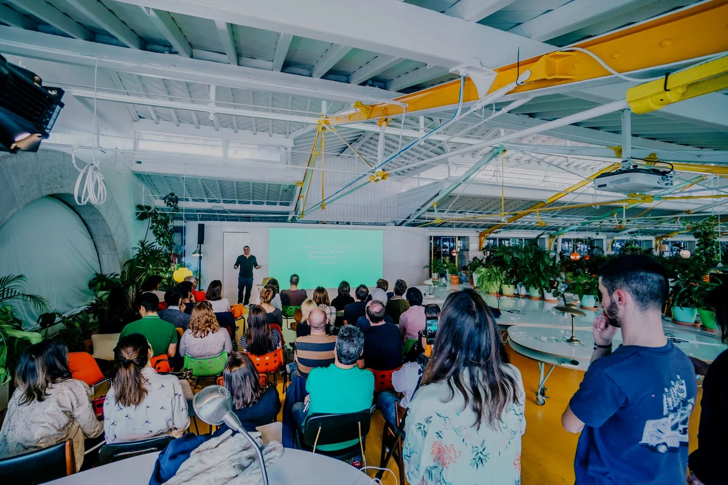 Jonas facilitating a large group session in a bright studio