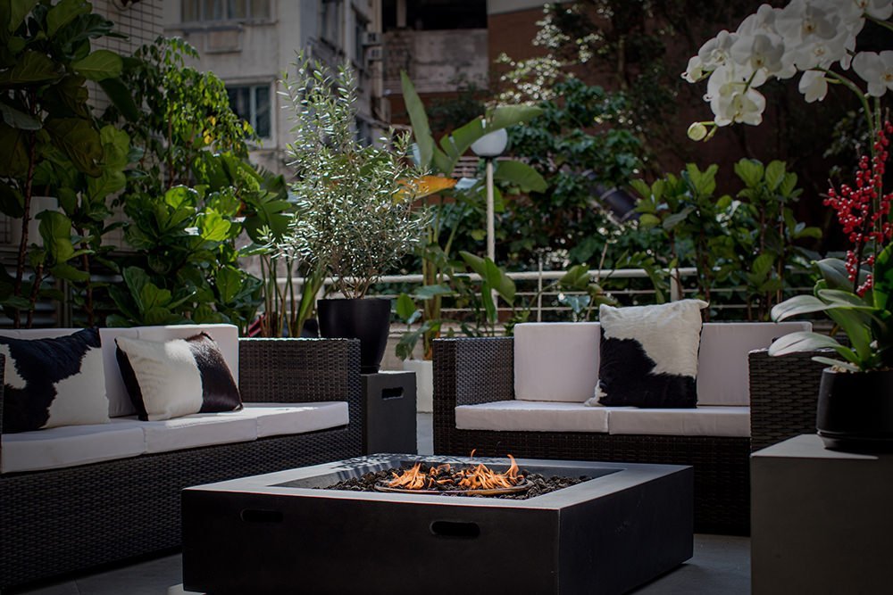 Hong Kong Interiors – Mid Levels outdoor space design fire pit rattan furniture