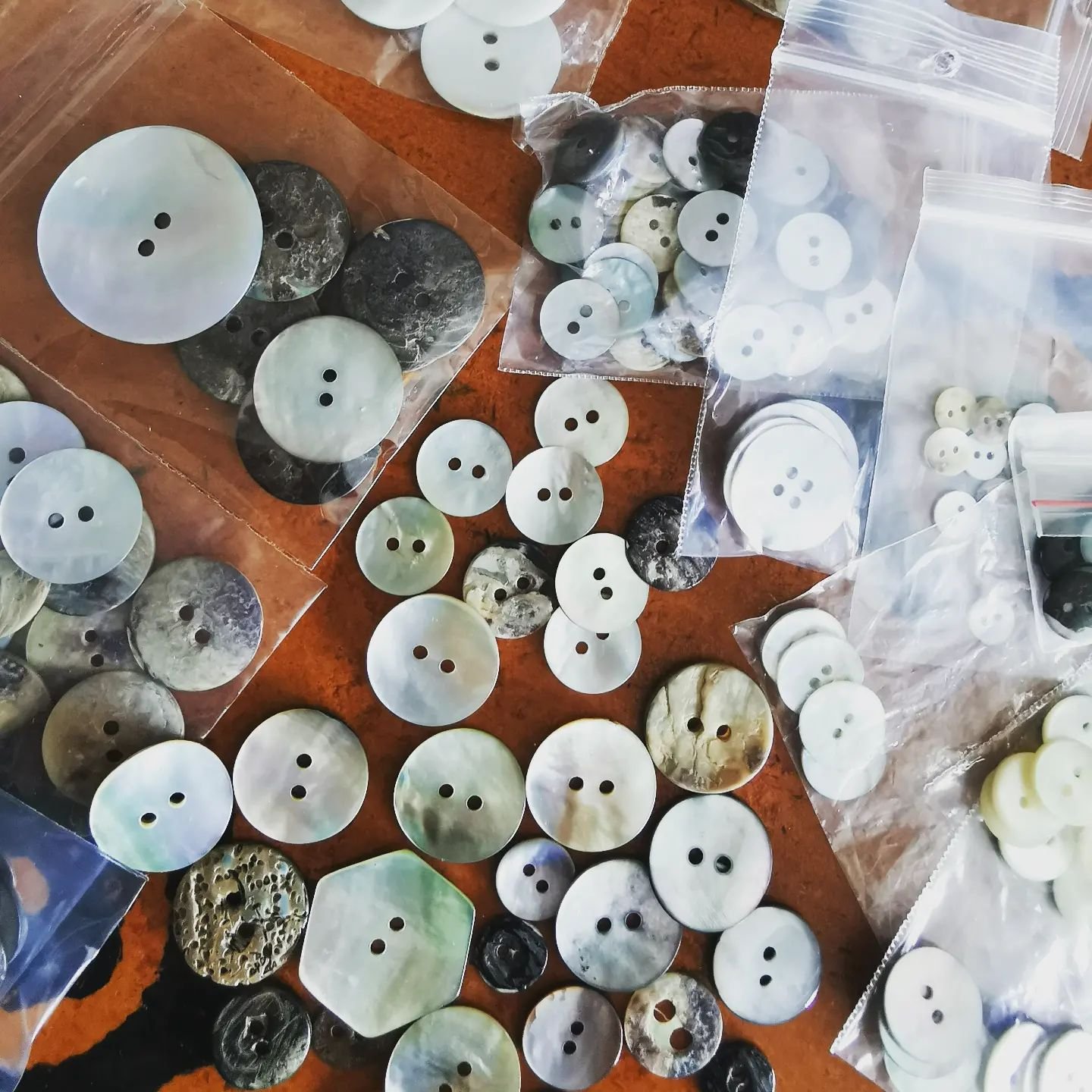 Buttons!! I don't use buttons often on my garments, but when I do they are usually natural shell or vintage ones. I've bought some of these pictured but most of this collection of shell buttons I've picked up in op shops.
If donated shirts are not we