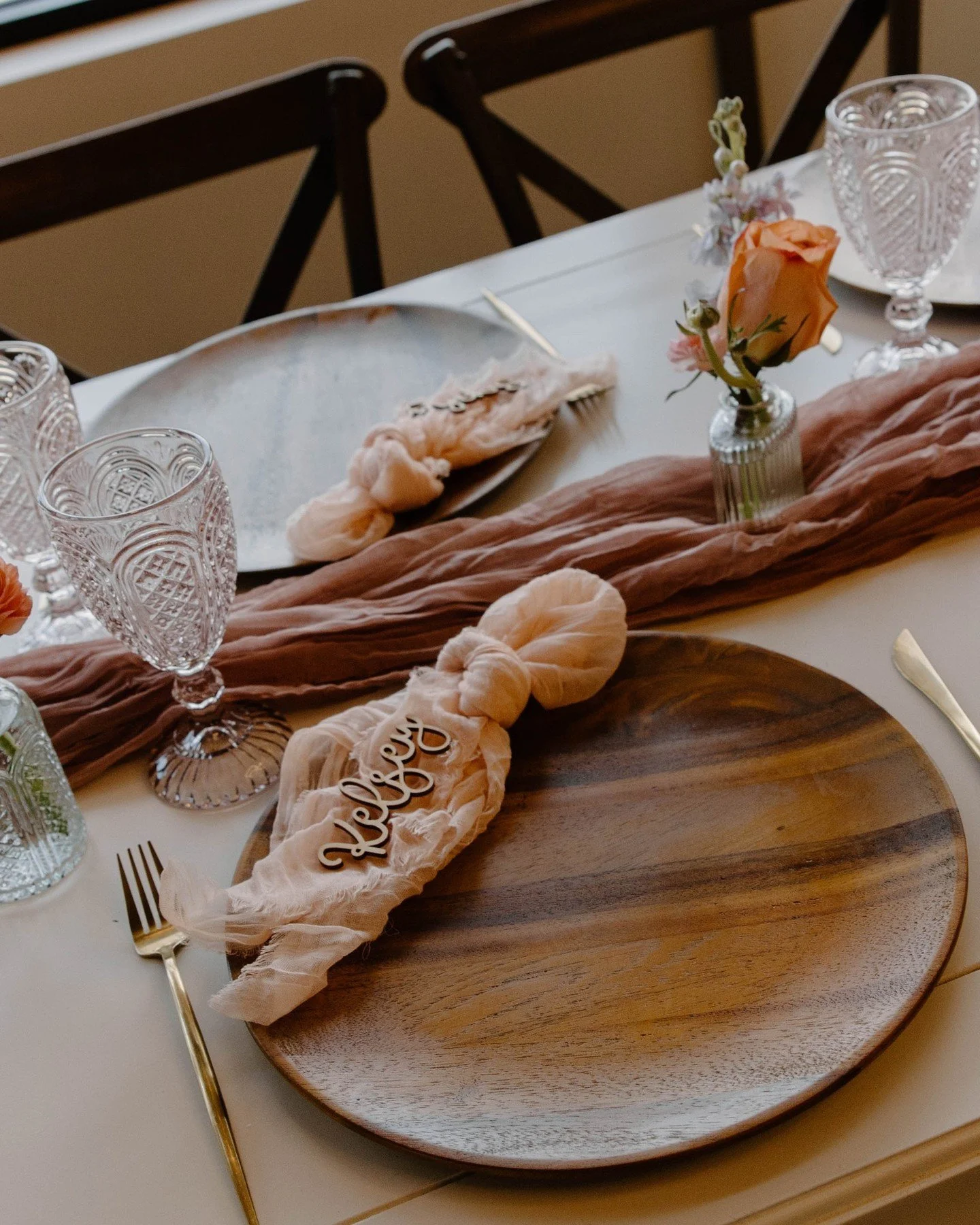 A way to spruce up any tablescape - custom chargers! 

I love these wooden chargers from Glasswing Rentals and how they tie in the rustic farmhouse vibe of the tables to contrast the feminine pinks of the flowers and runners. 

Every element of your 