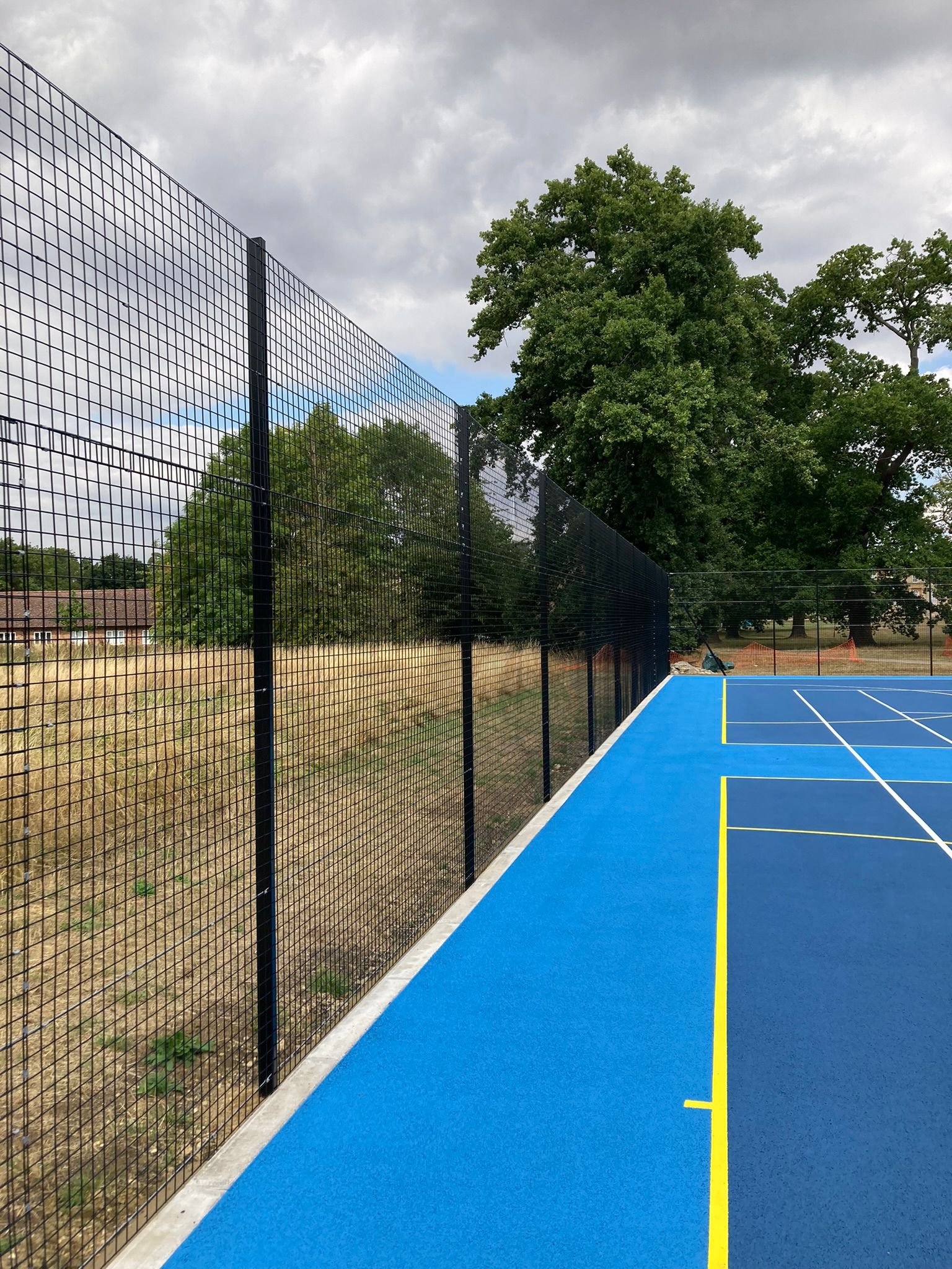 Weldmesh fencing around a sports pitch